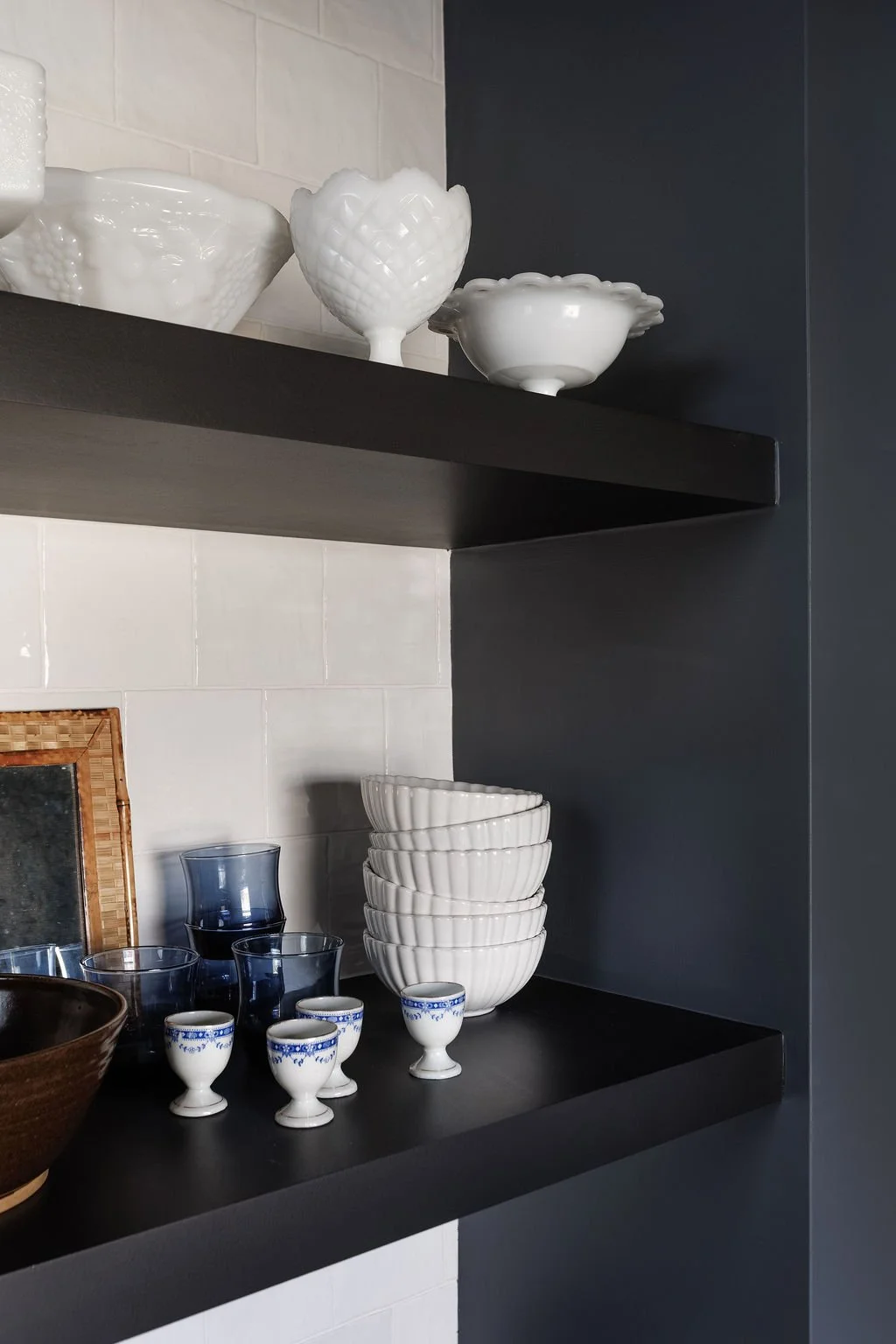 Selby Hotel floating shelving with pretty dishes and decor. 