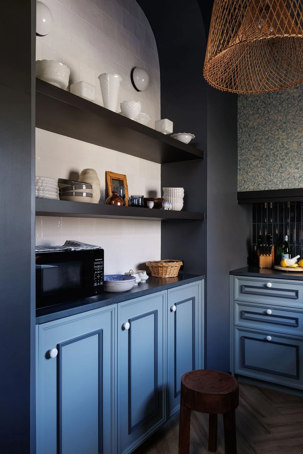 Sleby Hotel kitchen arched display shelving with dishes and decor.