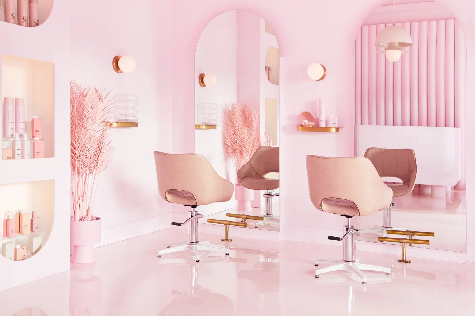 Pink Label Hair salon showing two hair chairs and arched mirrors.