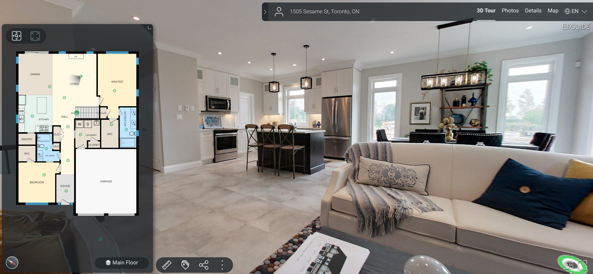 Open-concept living room and kitchen with a 3D tour overlay and floor plan on the left. The living room has a white couch with decorative pillows and a striped blanket, with a dark table nearby. The kitchen features white cabinets, a stainless steel