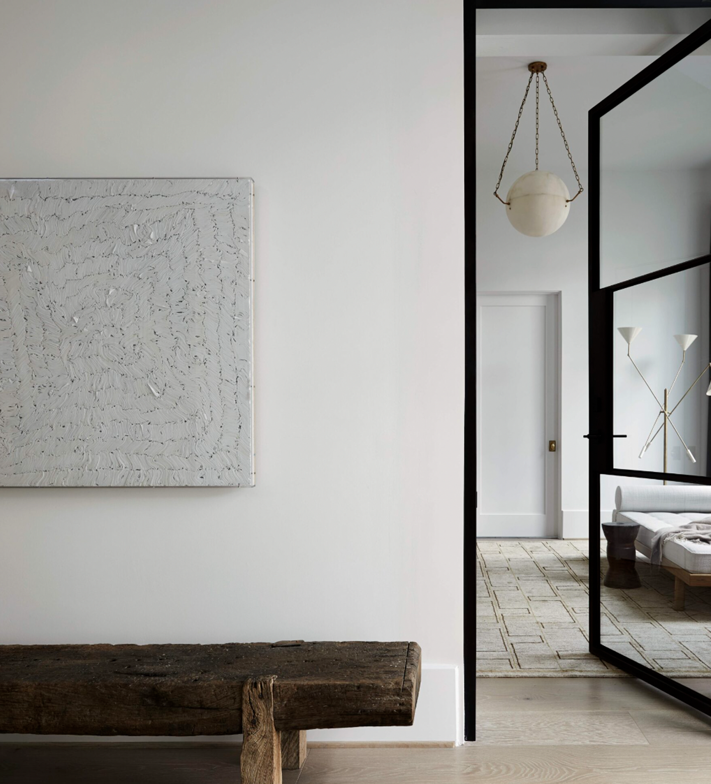 Interior view featuring the Atlas 450 alabaster wall sculpture by Maison Paname, styled in a neutral space by Augusta Hoffman.