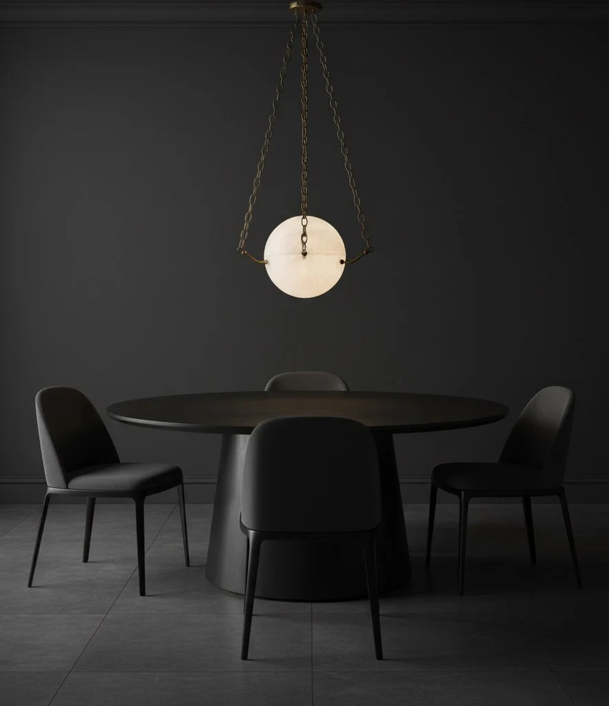 Atlas 300 alabaster chandelier installed over a dining table, showcasing warm ambient LED glow and antique brass chains. Sculptural luxury lighting designed for interior designers specifying custom, made-to-order statement fixtures.