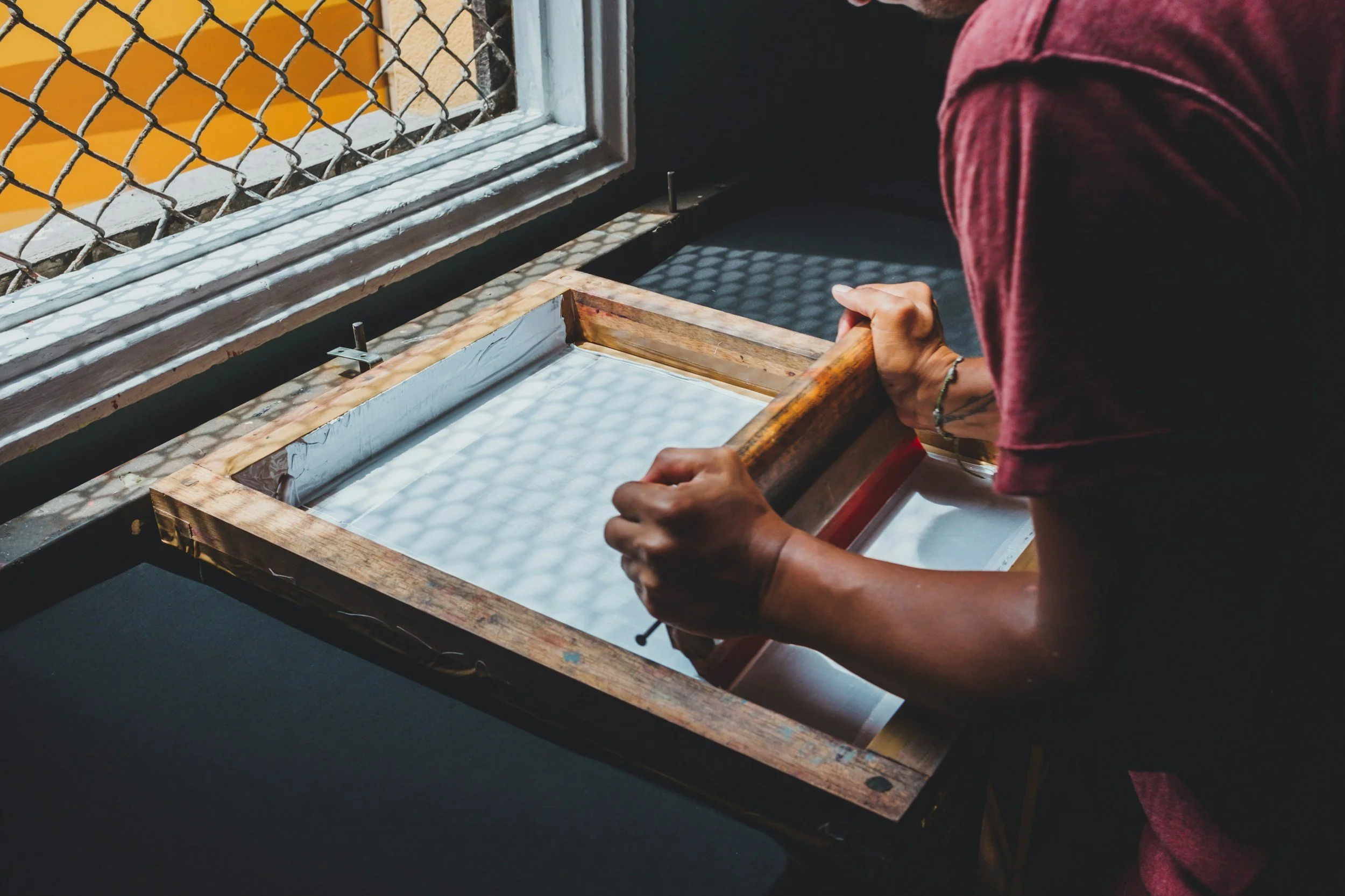 A photo of someone printmaking