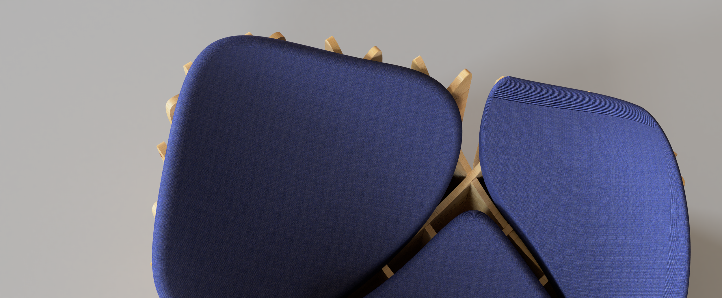 Close-up of stacked blue chairs with wooden legs against a plain gray background.