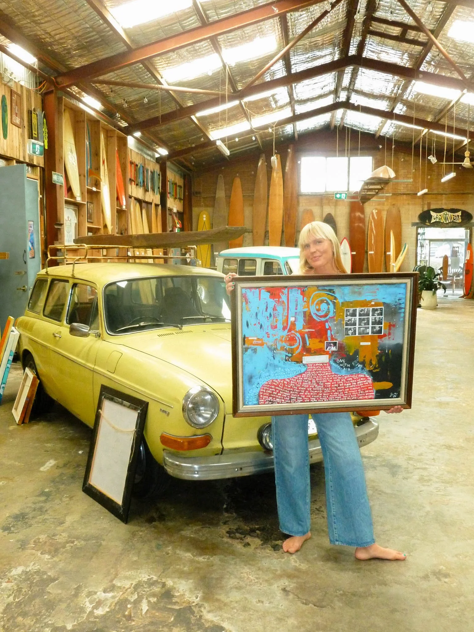 Sonja Vahasaari and her painting in Interconnectedness art exhibition.