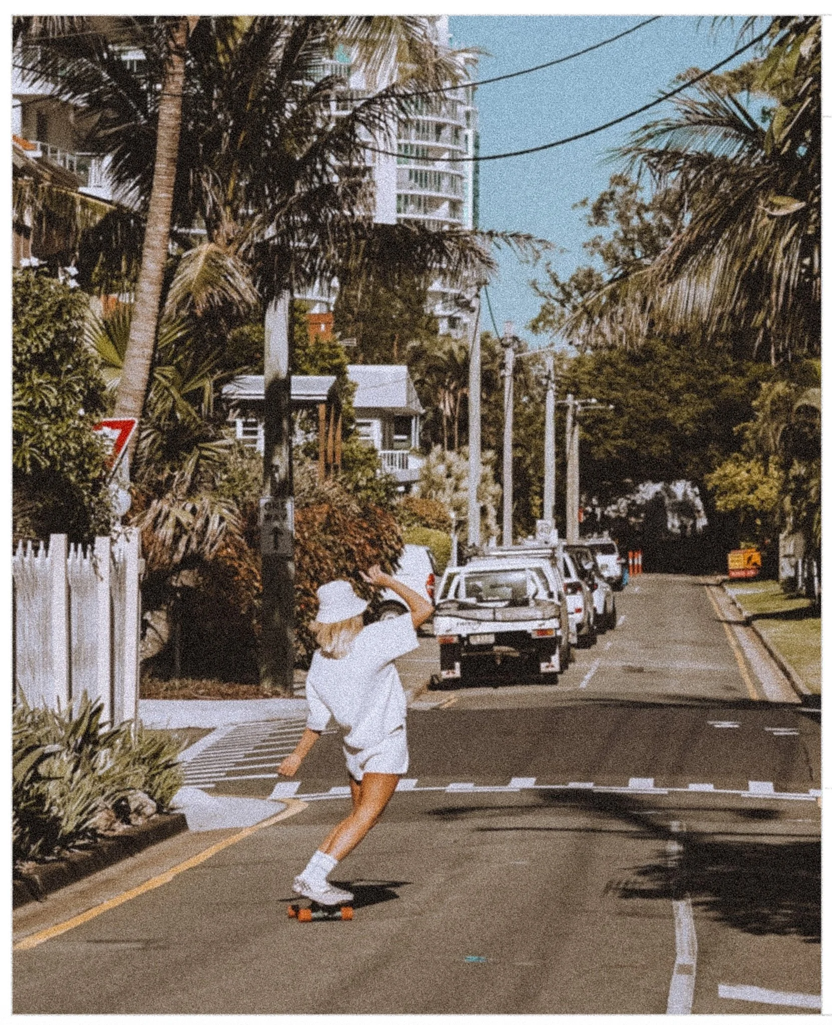 Sonja riding Penny Skateboard on Gold Coast streets.