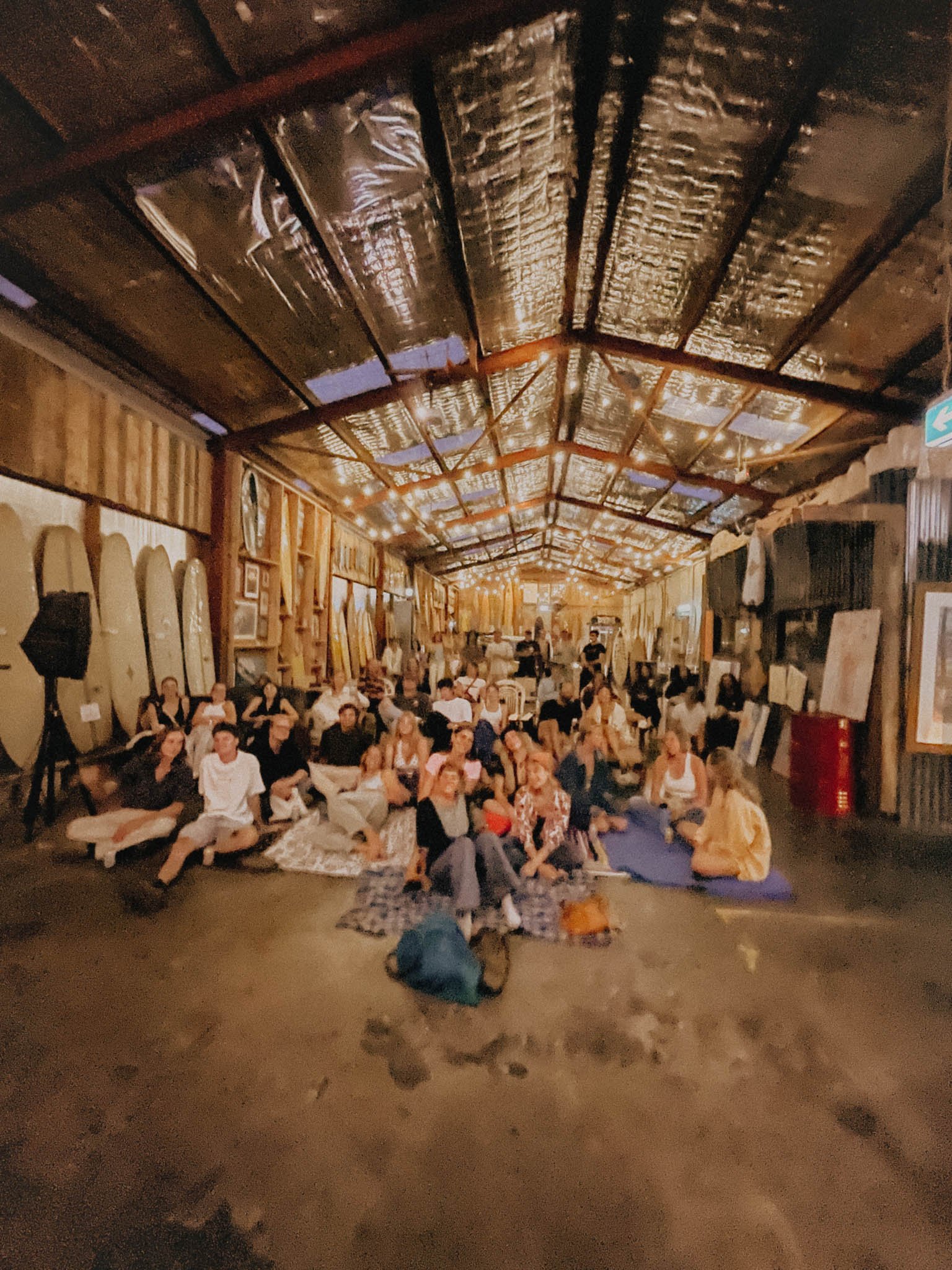 Crowd cheering in Interconnectedness art exhibition.