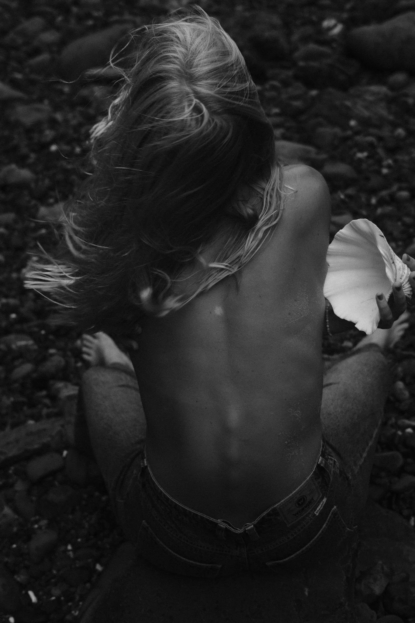 Portrait of Sonja Vahasaari in Wrangler denim styled with shell accessories.