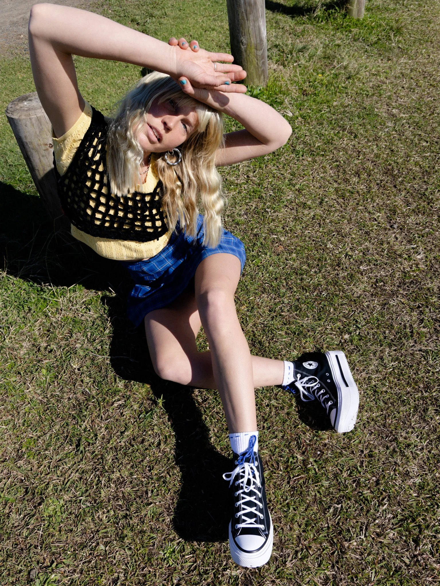 Sonja Vahasaari modeling Converse sneakers with her handmade crochet top.