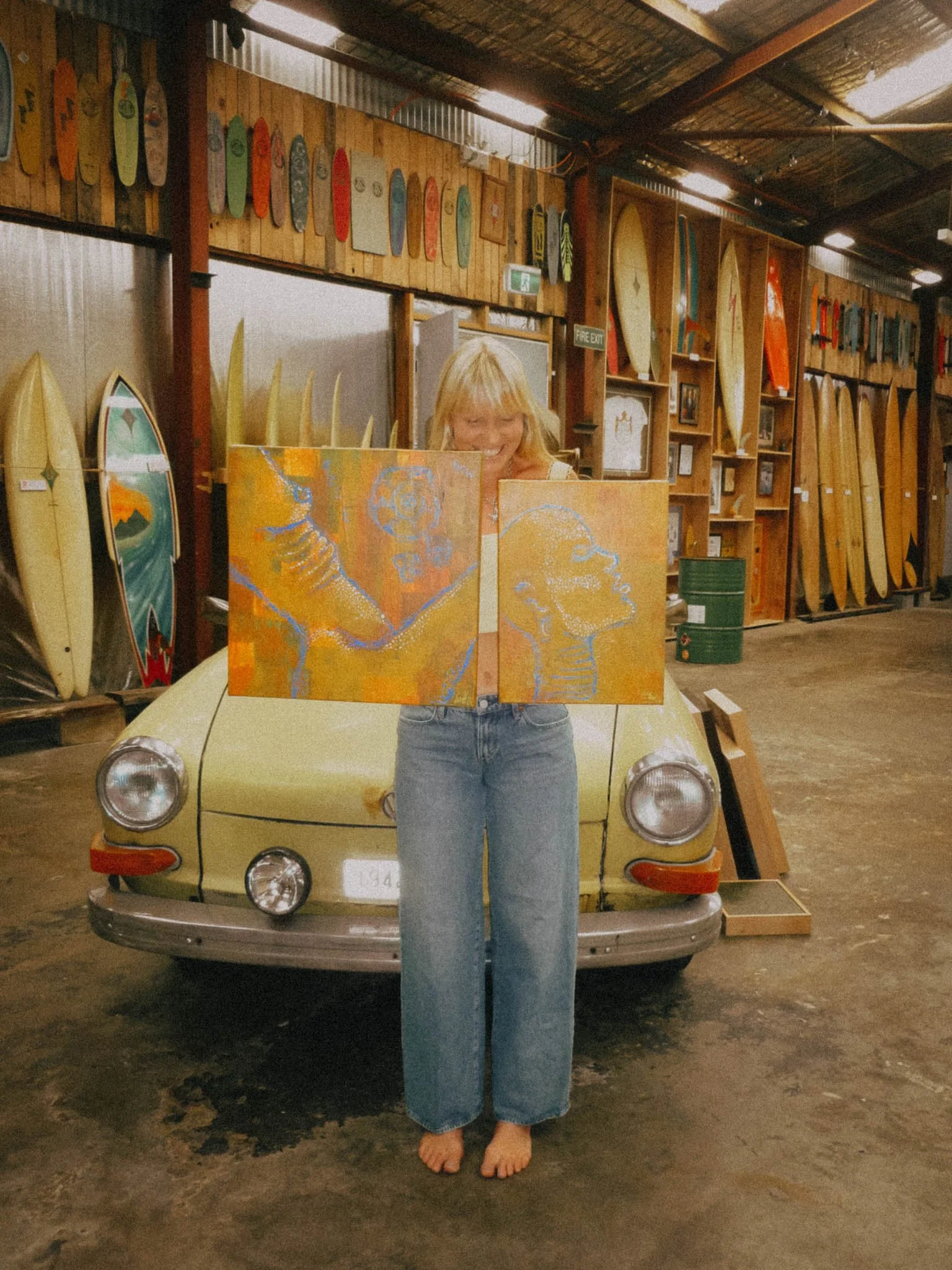 Sonja Vahasaari and her painting in Interconnectedness art exhibition.