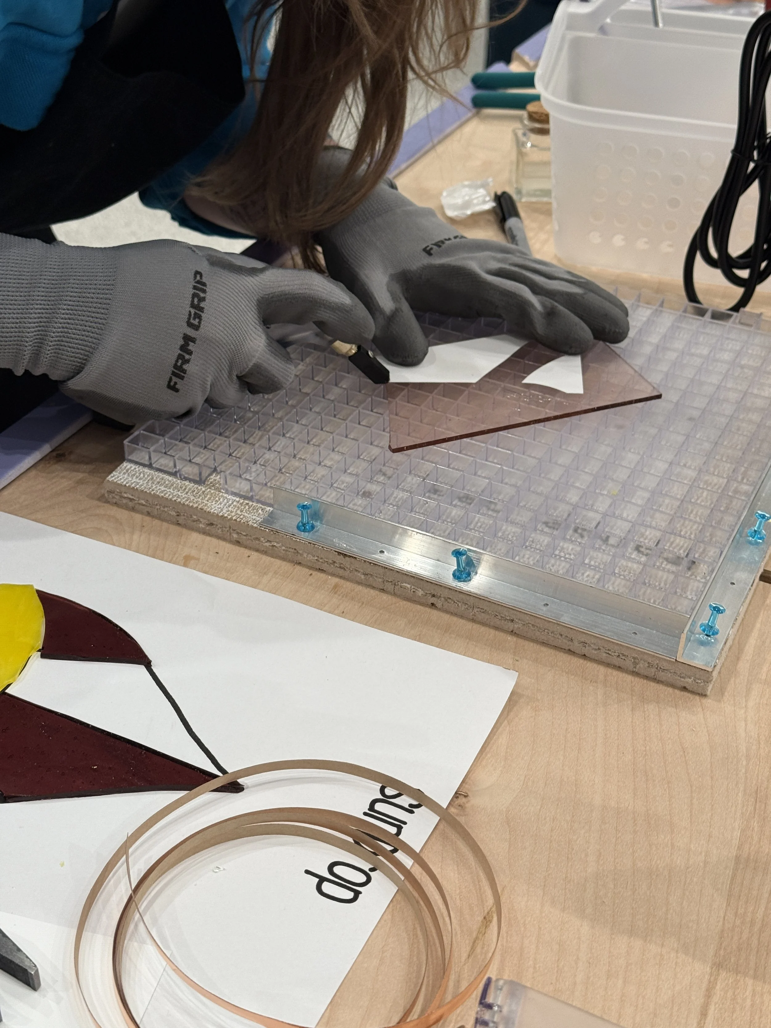 Beginner stained glass workshop making a teardrop design