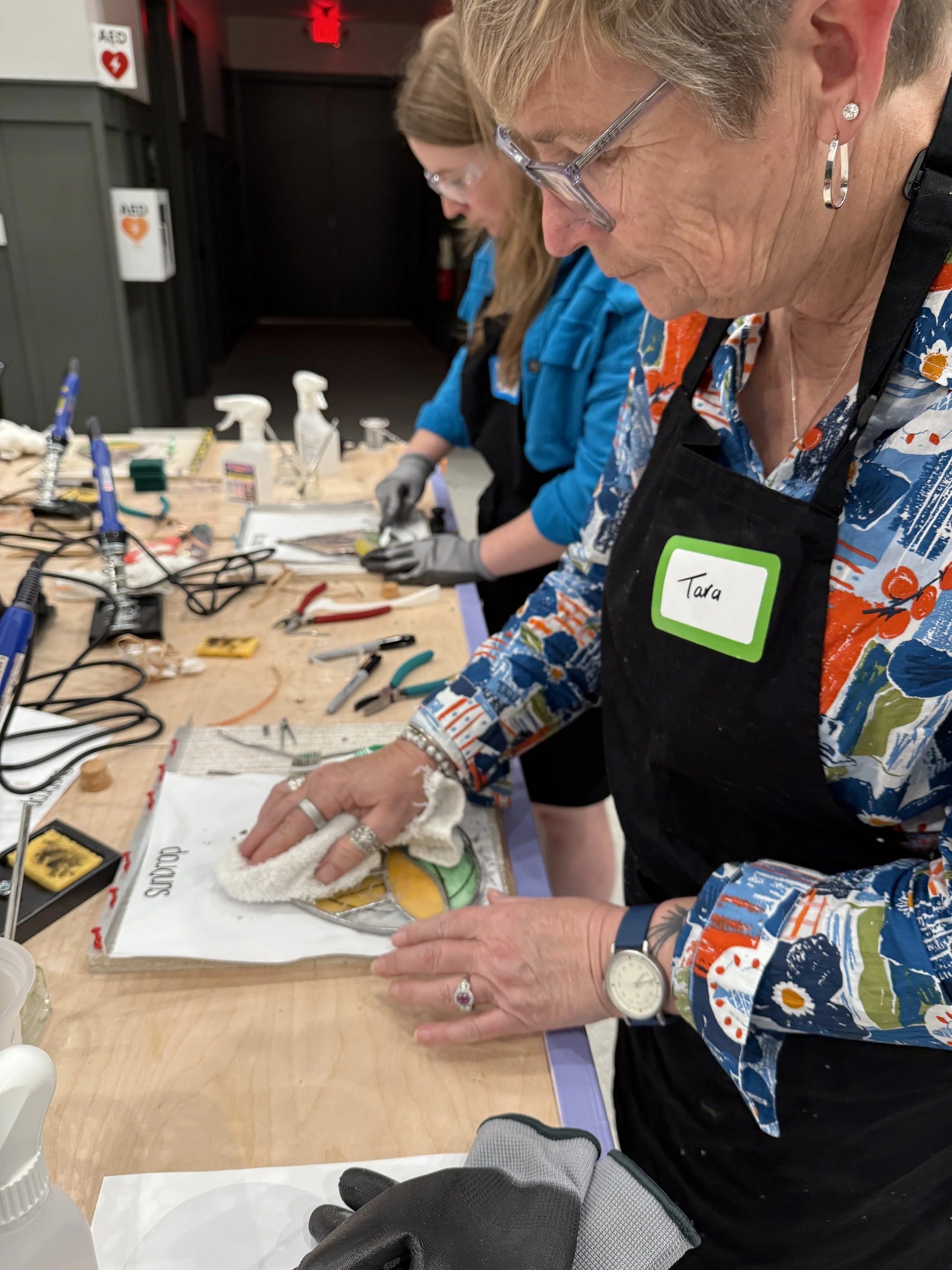 Beginner stained glass workshop making a teardrop design