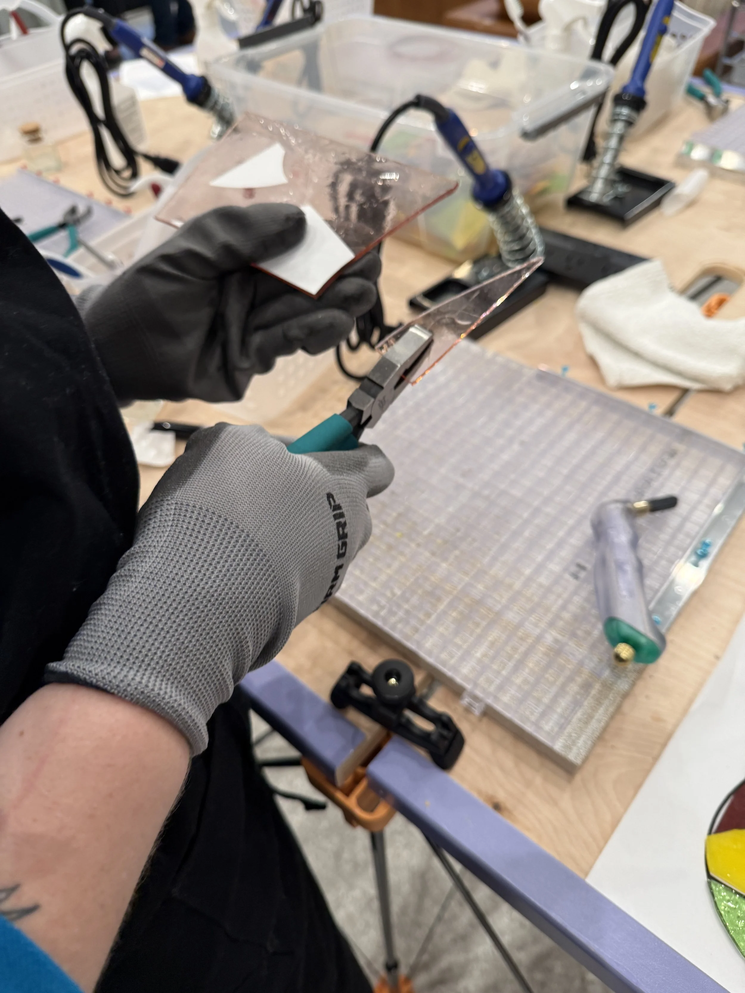 Beginner stained glass workshop making a teardrop design