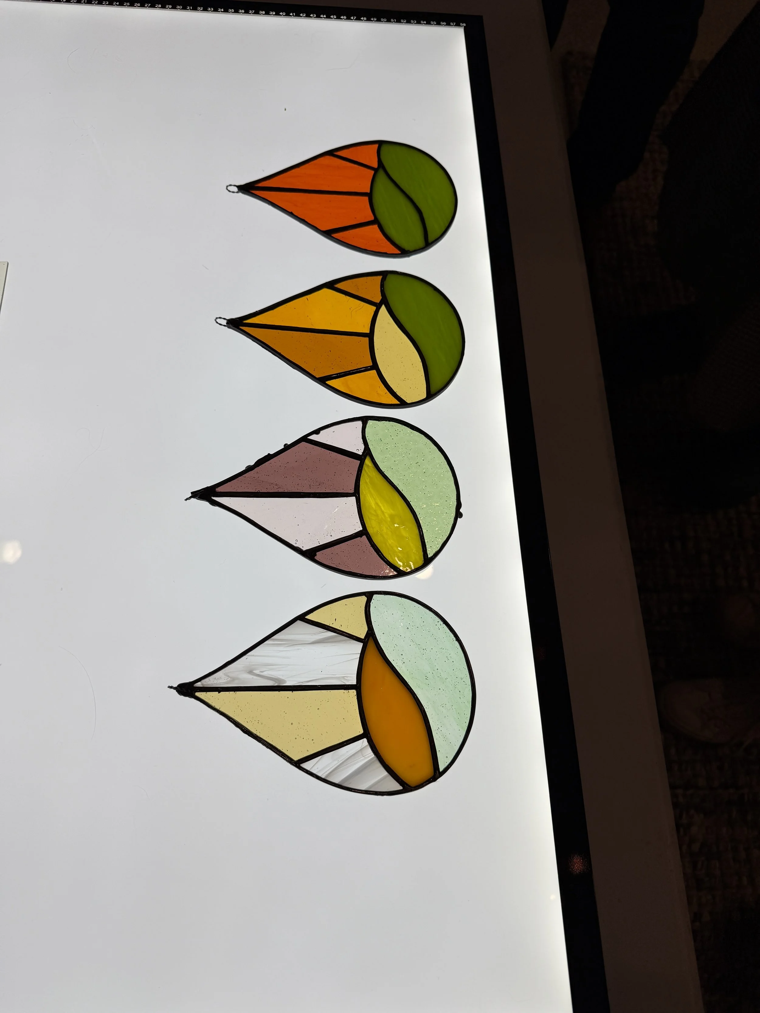 Beginner stained glass workshop making a teardrop design