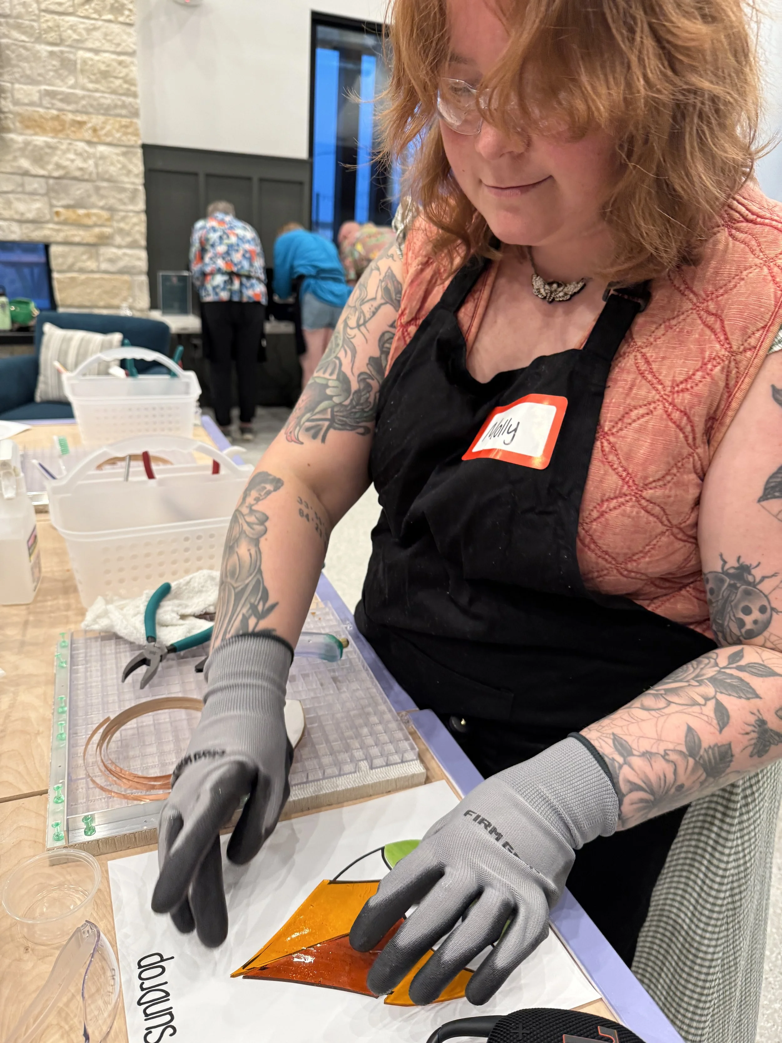 Beginner stained glass workshop making a teardrop design