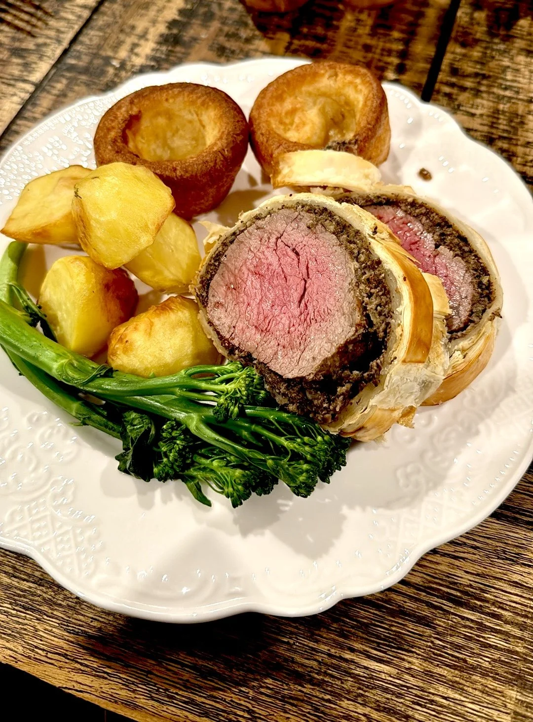 Tender venison backstrap wellingtons, crispy roast potatoes, fresh broccolini and buttery yorkshire puddings.