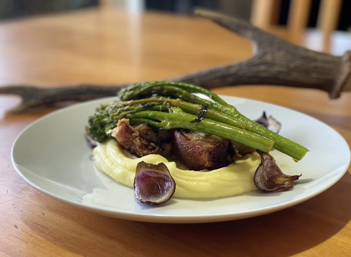 Slow Roasted Pork Belly, creamy mash, tender broccolini with rich au jus.