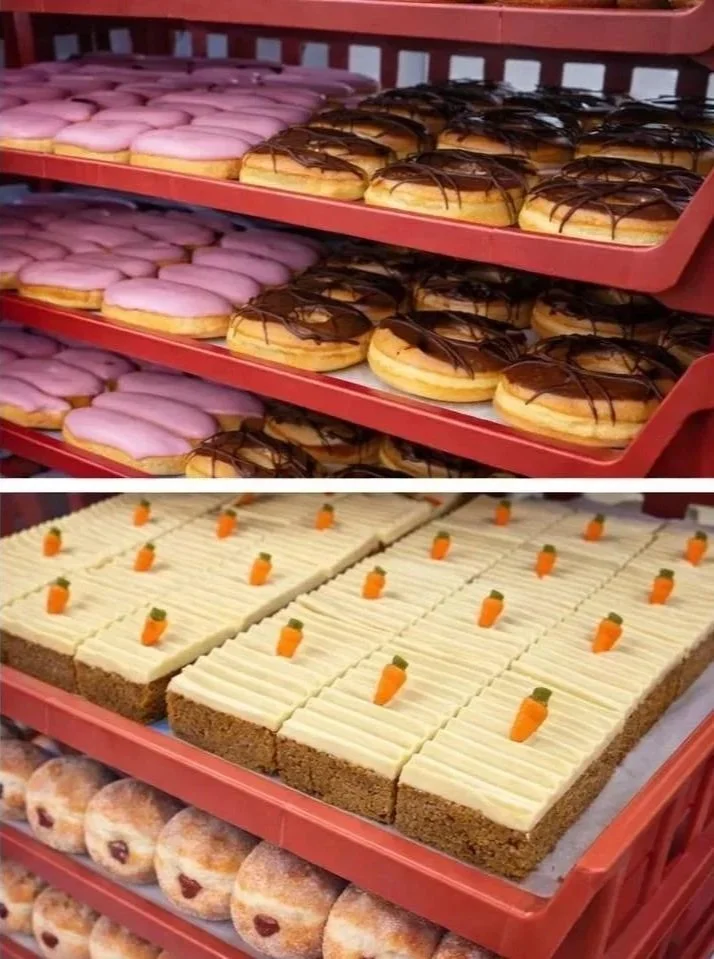 Close-up of trays filled with Friary Mill doughnuts and cakes