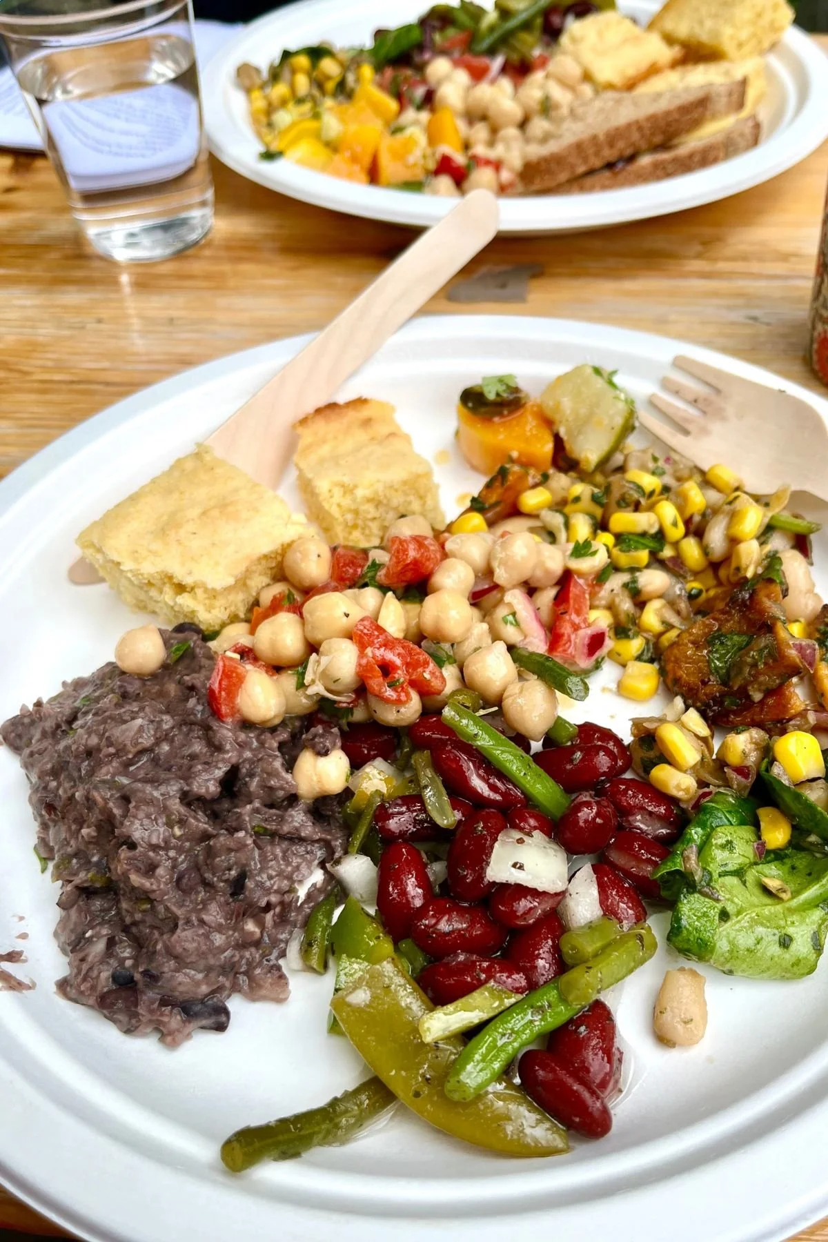 Plate of assorted salads, beans, chickpeas salad, roasted vegetable, served as part of the St James Day lunch at St James Piccadilly. 