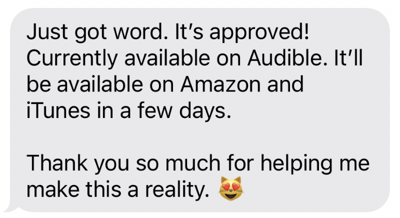 Text message with an emoji of a cat with heart eyes, expressing excitement about a book called 'The Gathering Girl' being approved and available on Audible, Amazon, and iTunes.