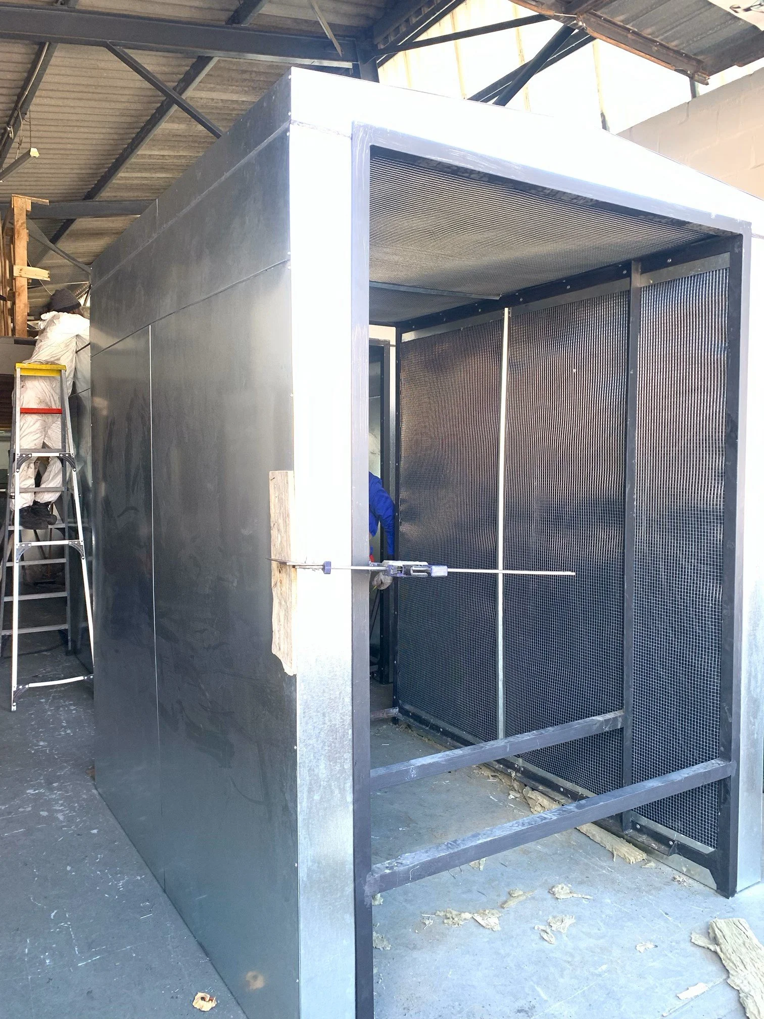 Arkangel Manufacturing designed and fabricated a steel acoustic housing with noise-absorbing panels and ventilation systems.