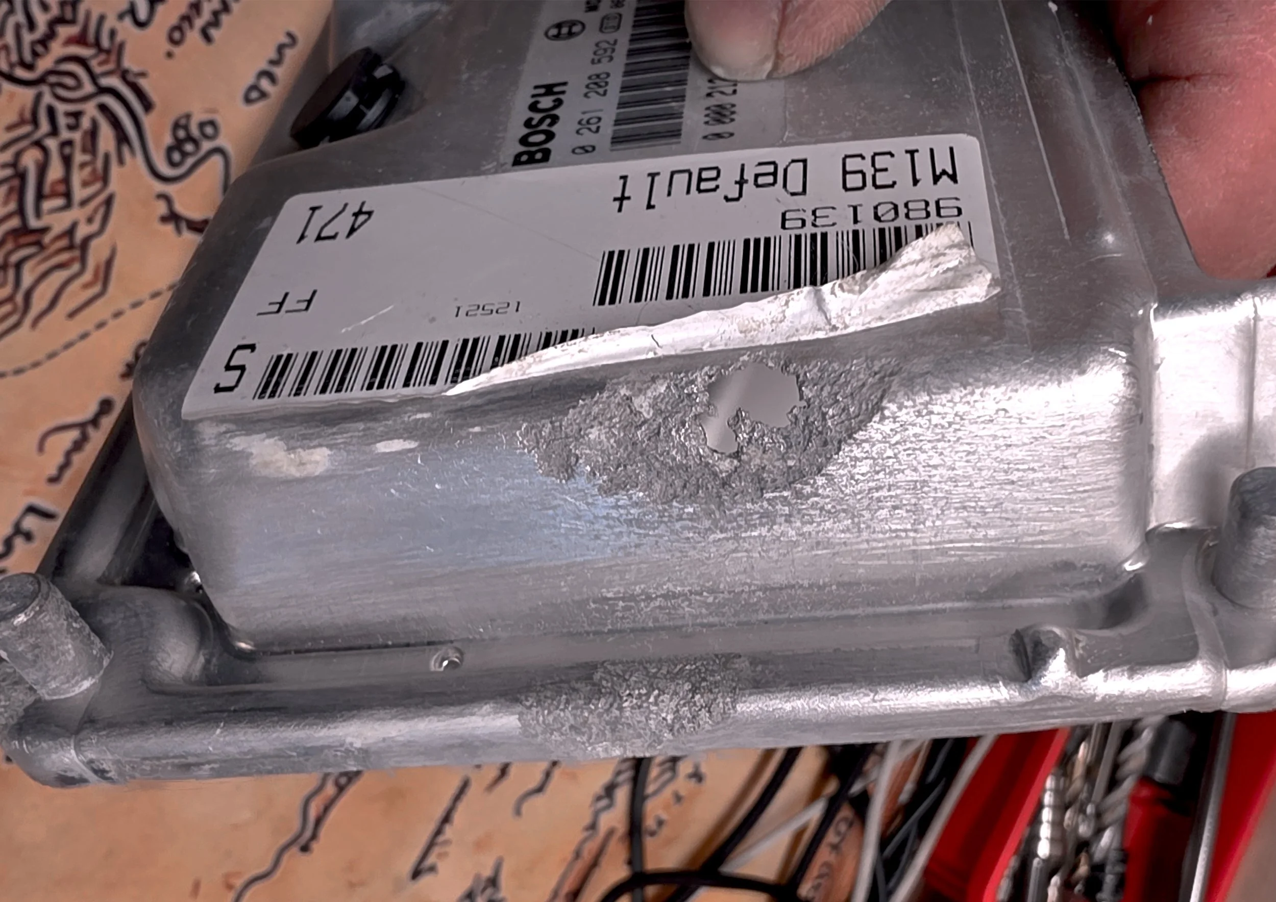 ECU with a hole in it due to water damage, fixed and tuned by Nightfall Automotive