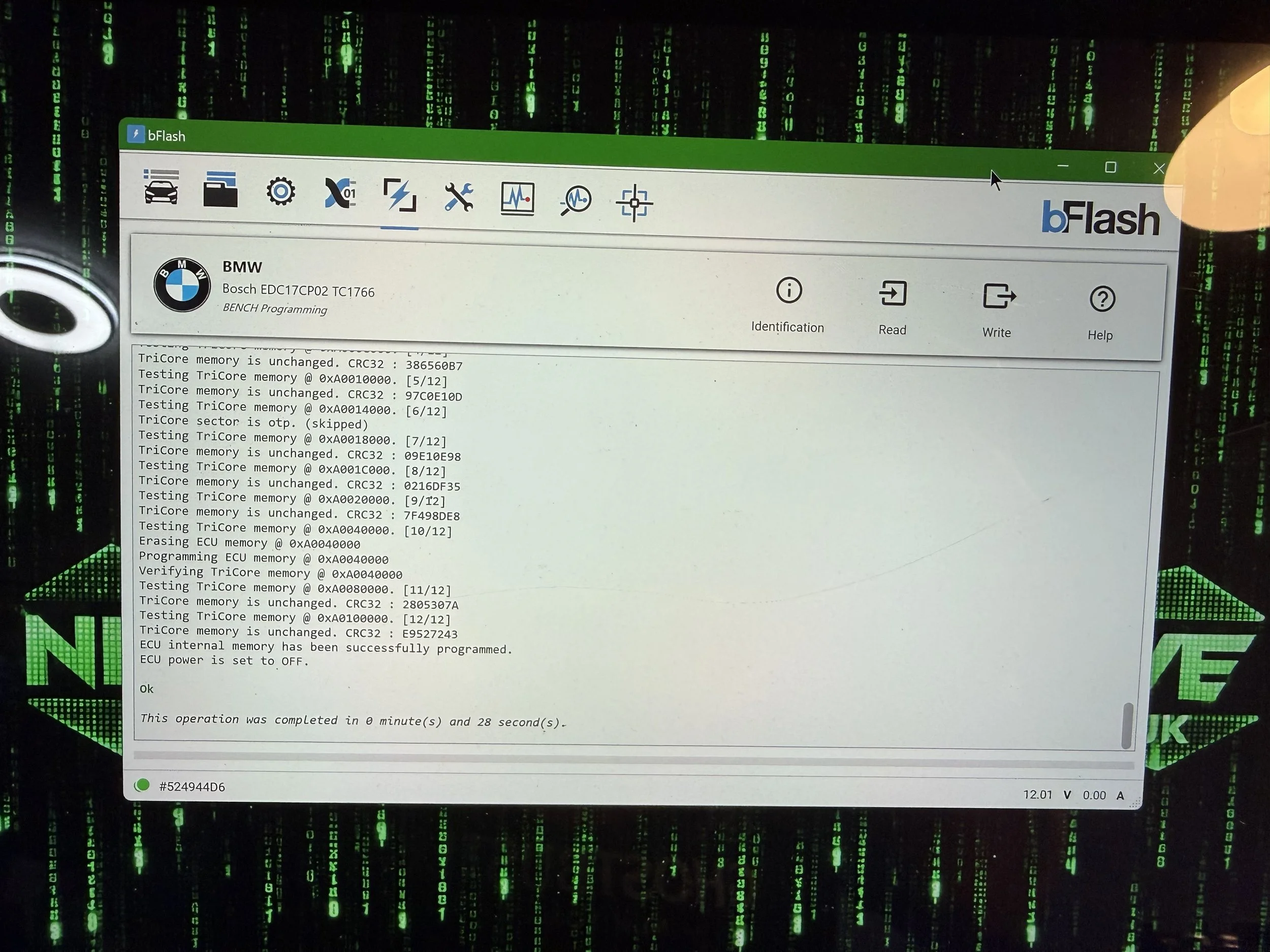 A screenshot of a software interface named bFlash used for programming a BMW vehicle's ECU. The background features a green digital matrix pattern reminiscent of computer code.