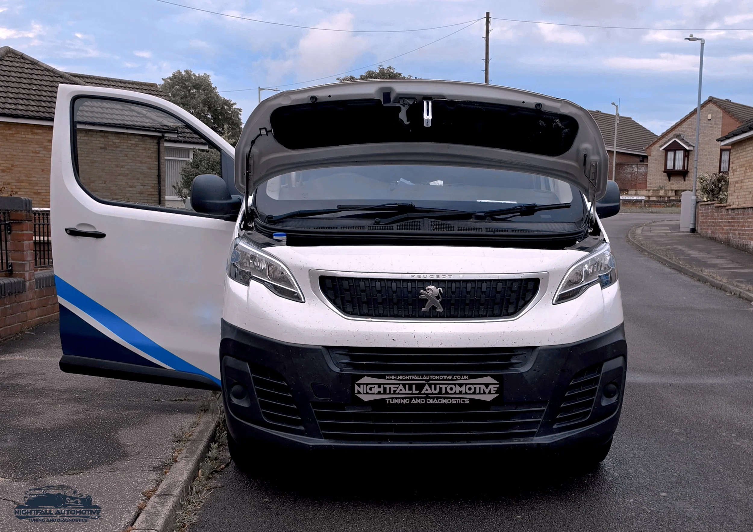 A white Peugeot van with the hood open, parked on a residential street with brick houses and a cloudy sky. tuned by Nightfall Automotive