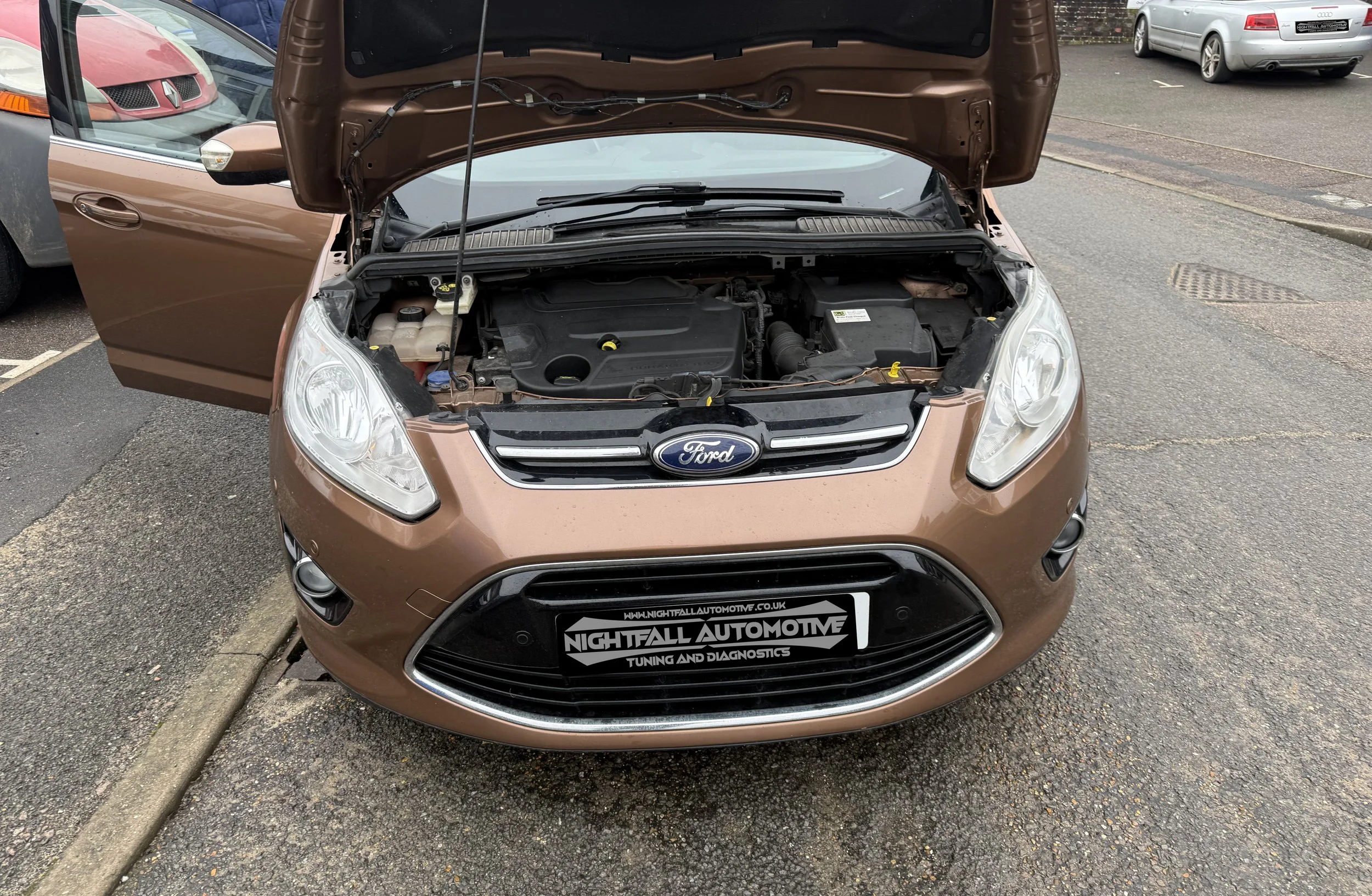 A brown Ford car ready for its stg1 and egr solution, all done over OBD with Bflash.