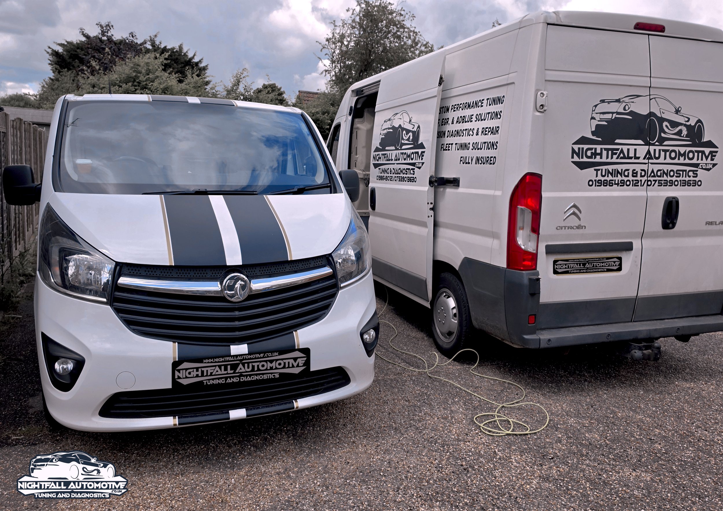 White van and car with Nightfall Automotive branding parked on gravel outside, with cloudy sky and trees in the background. tuned by Nightfall Automotive