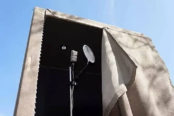 Portable vocal booth set up on location for mobile voiceover recording.