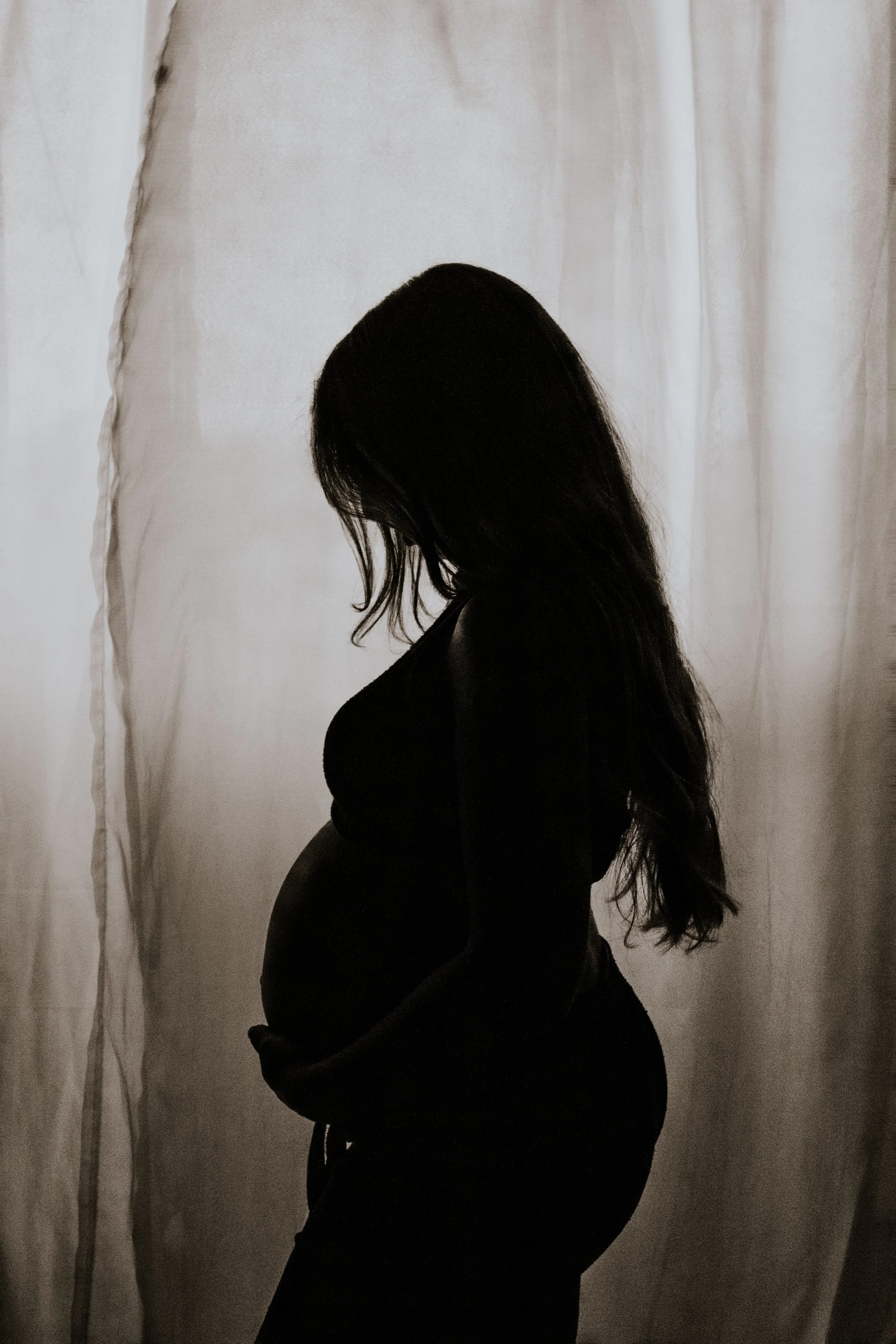 Postpartum mother taking control of her intimate health and exploring postpartum vaginal restoration
