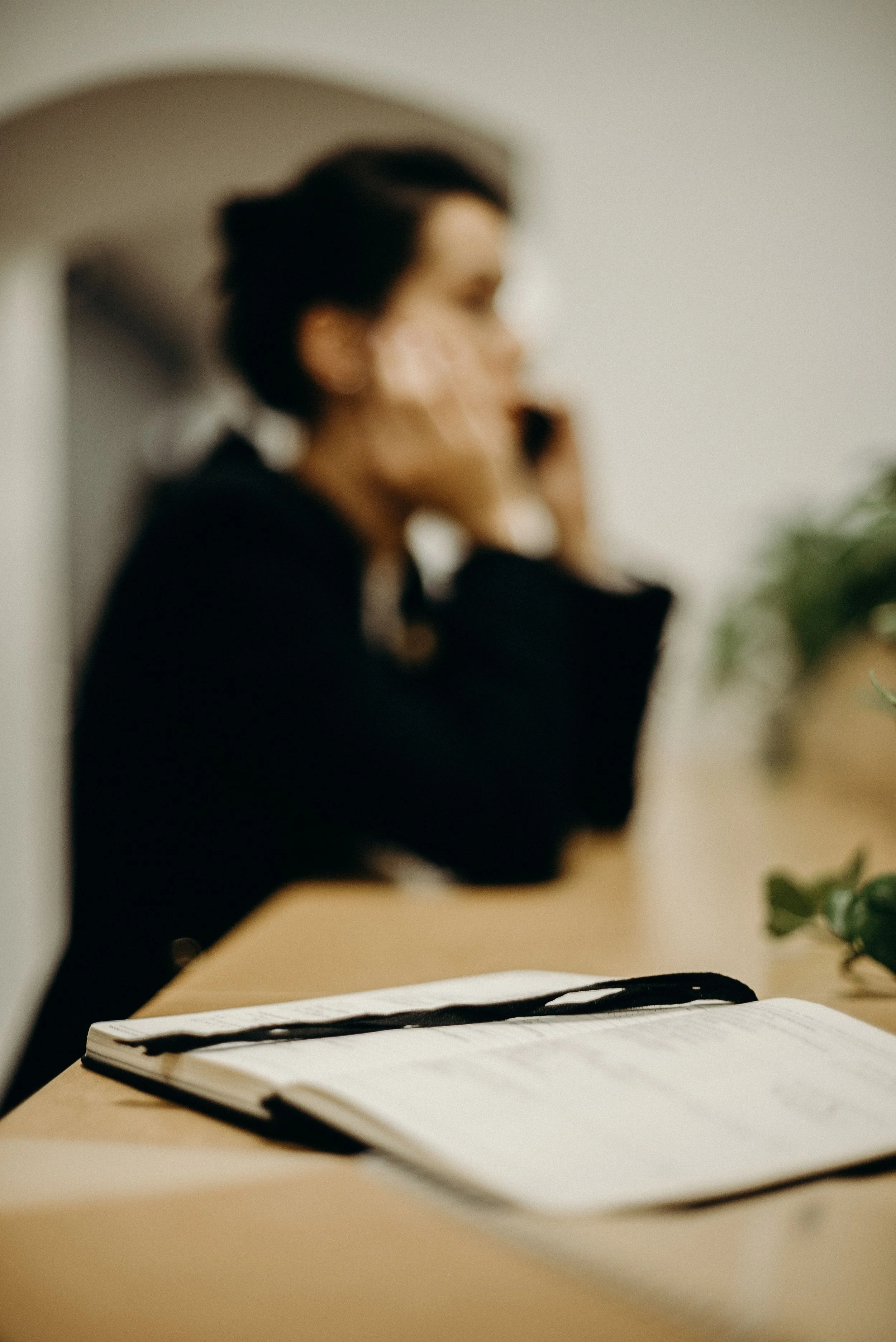 Woman calling to schedule an EMSella consultation and pelvic floor treatment appointment in Arlington TX