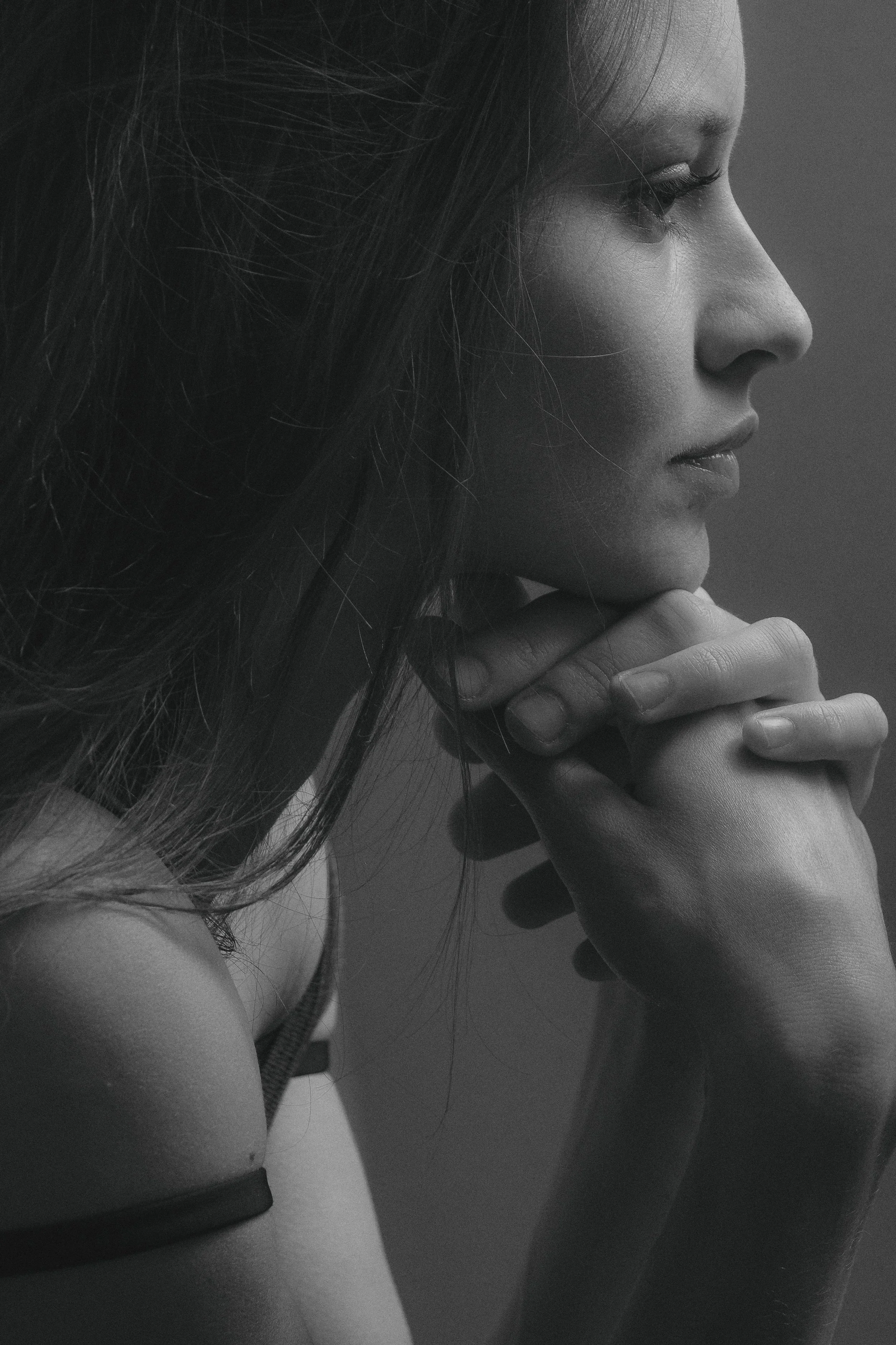 Woman thoughtfully considering her symptoms and exploring potential treatment options