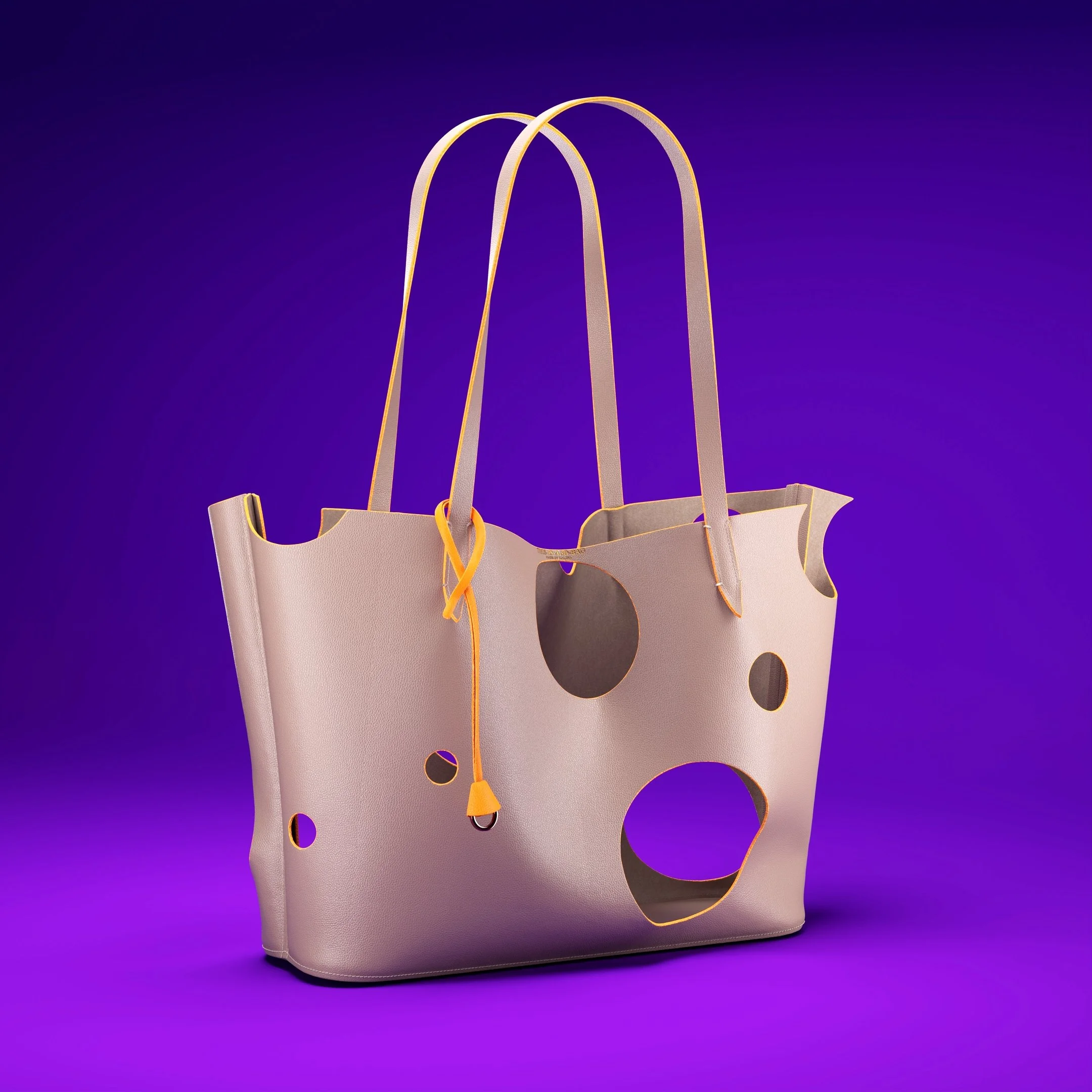 Pink tote bag with circular cutouts and yellow handles against a purple background.
