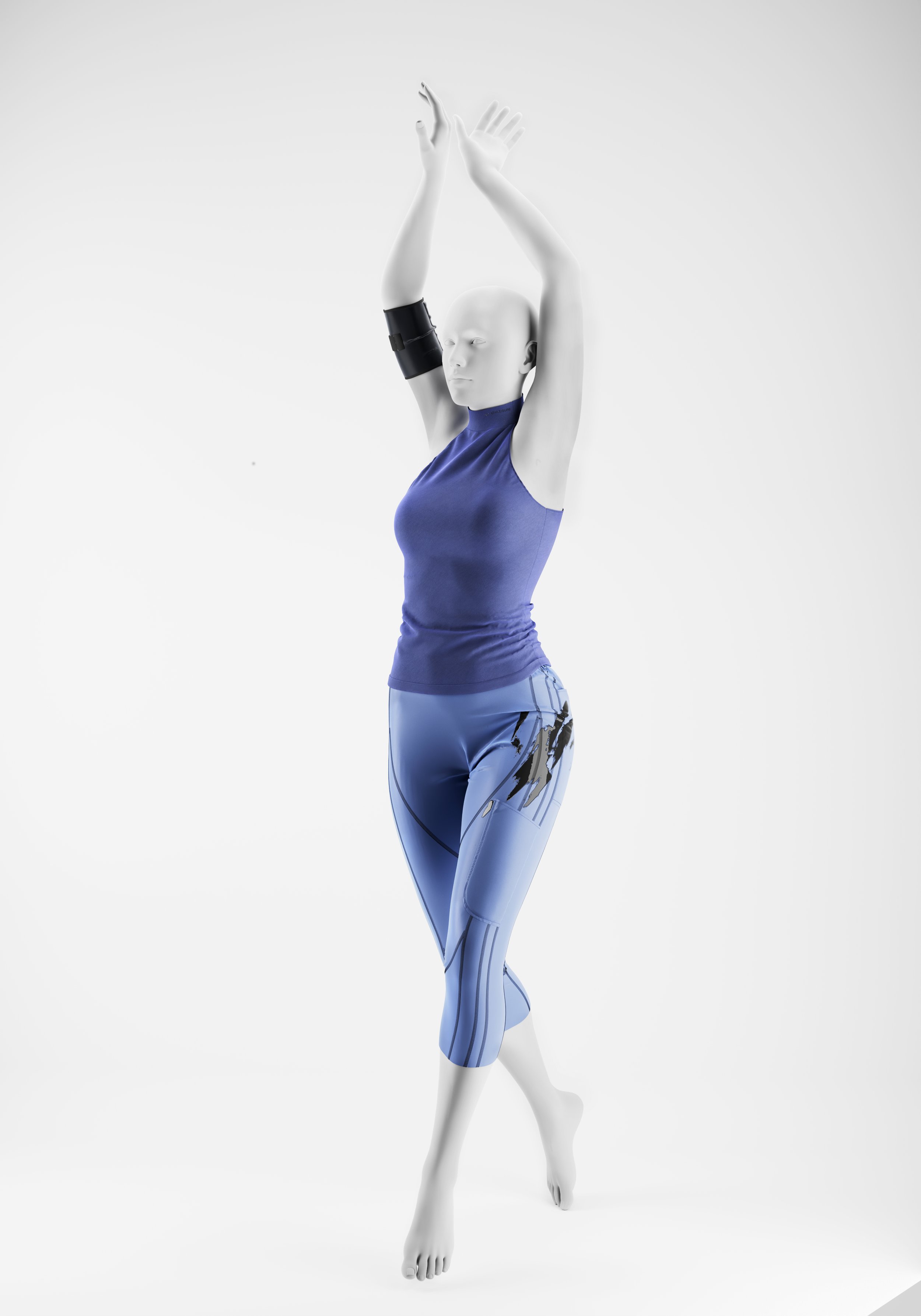 A mannequin dressed in a blue athletic tank top and patterned workout leggings, stretching with arms raised above head against a plain white background.