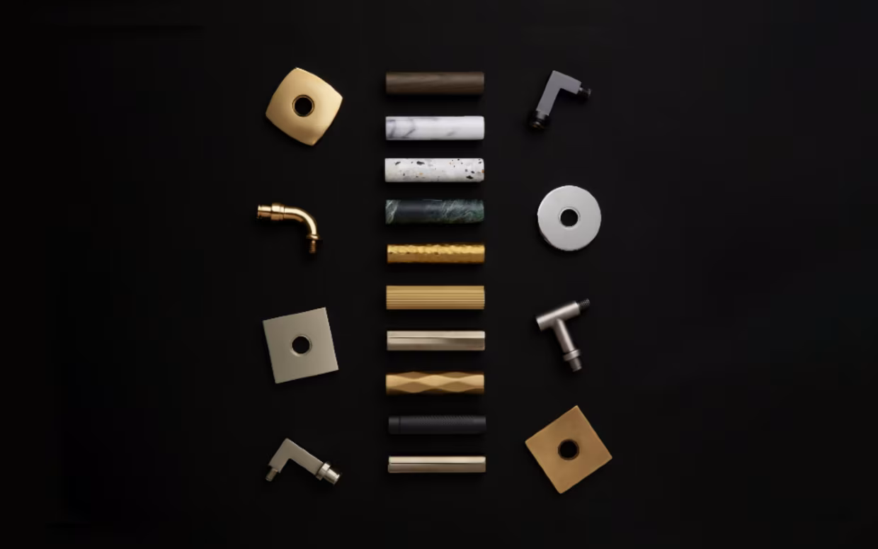Various geometric-shaped objects in different colors and finishes arranged on a black background