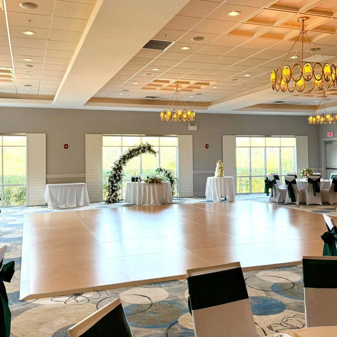 With our soaring ceilings and natural-lit ballroom, we provide a simple backdrop for you to customize to best fit your event day vibe! 
Pictured here, a recent wedding using our cozy conference chairs but elevated with chair covers. Whether you are l