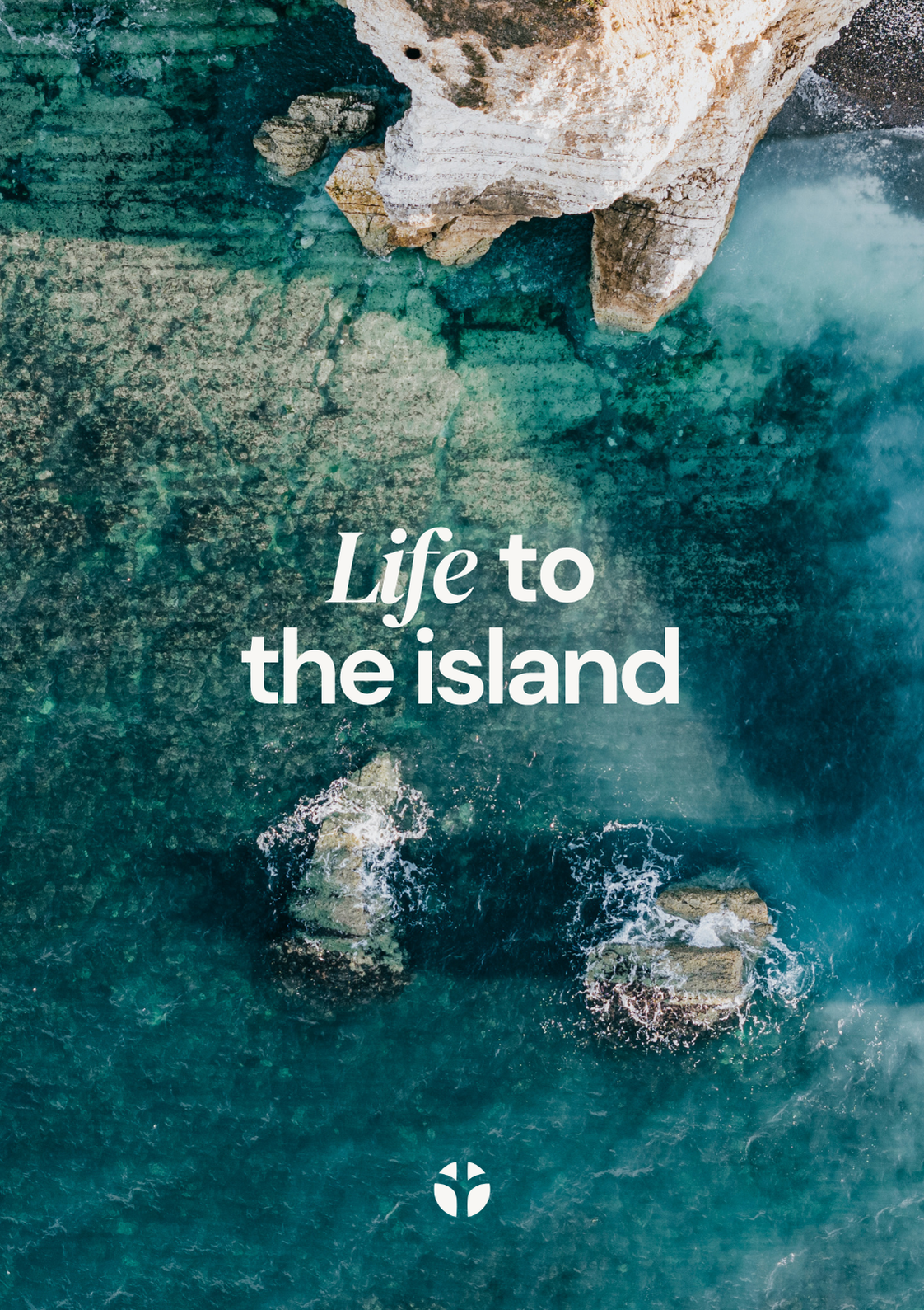 Aerial way of rocks and sea with the words Life to the island