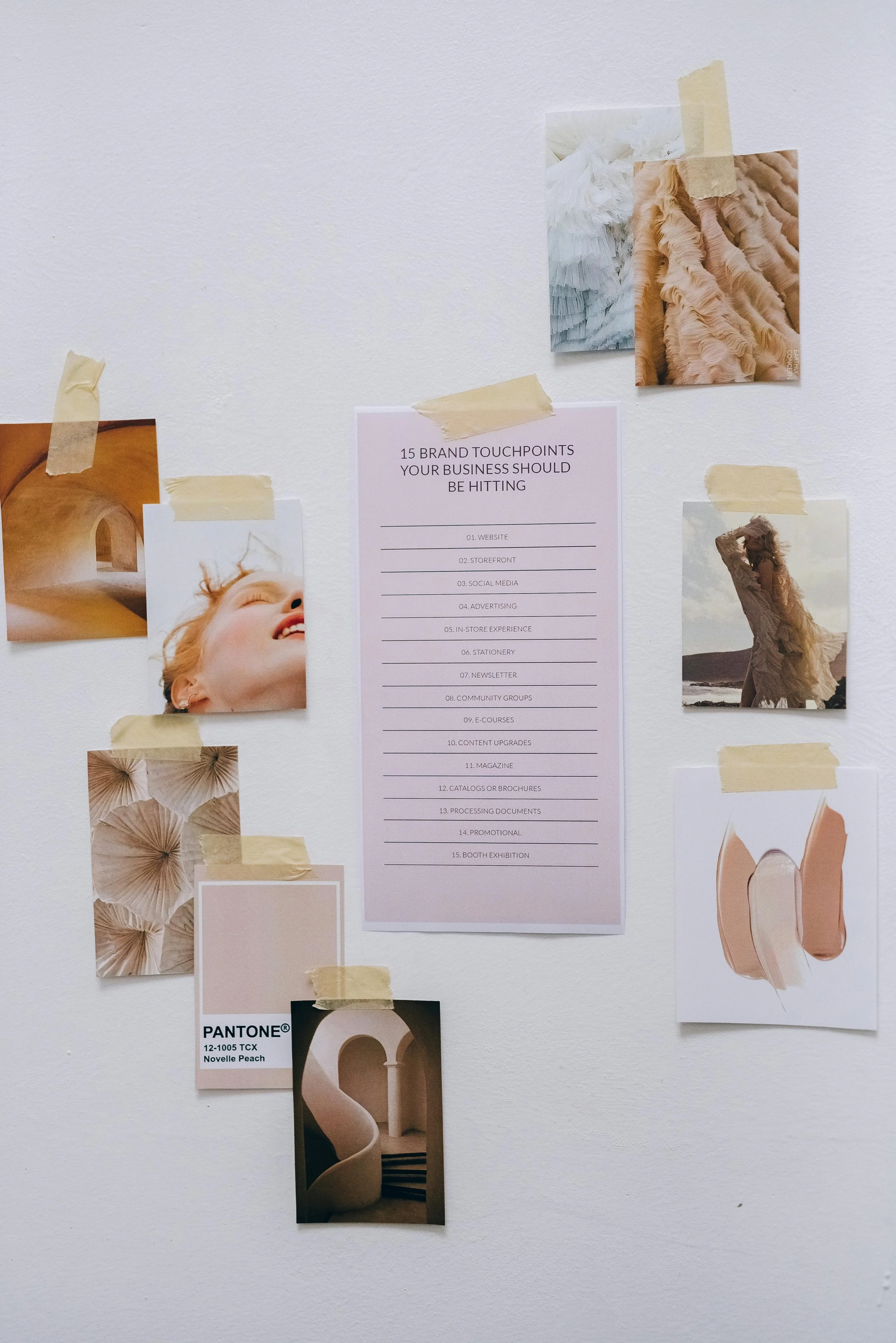 A wall with various photos, a color palette, and a list of 15 business touchpoints as a central pink sheet. The photos include textures, a smiling woman, architectural elements, and natural landscapes. The color palette features neutral beige and peach tones.