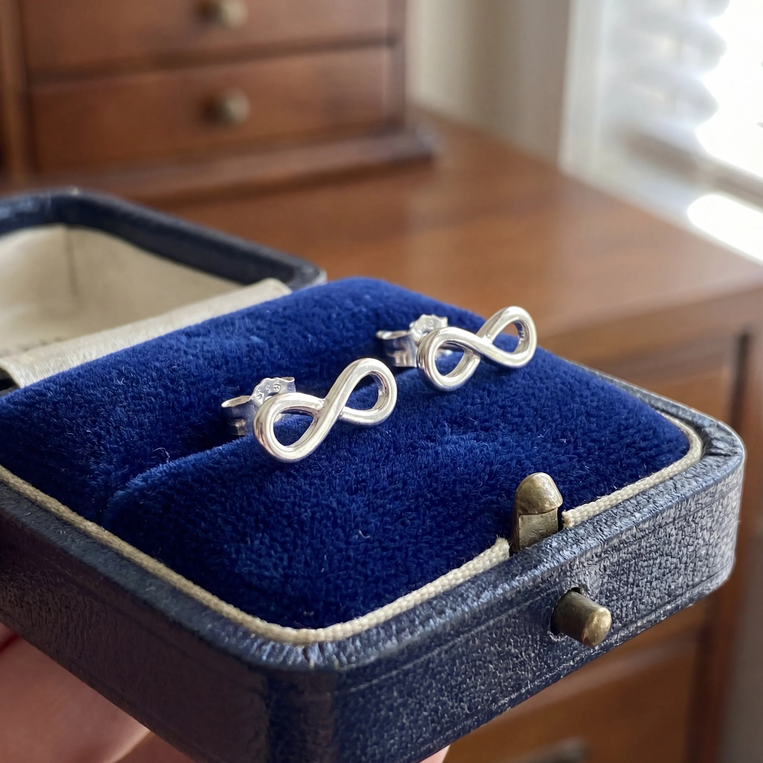 White Gold Infinity Stud Earrings