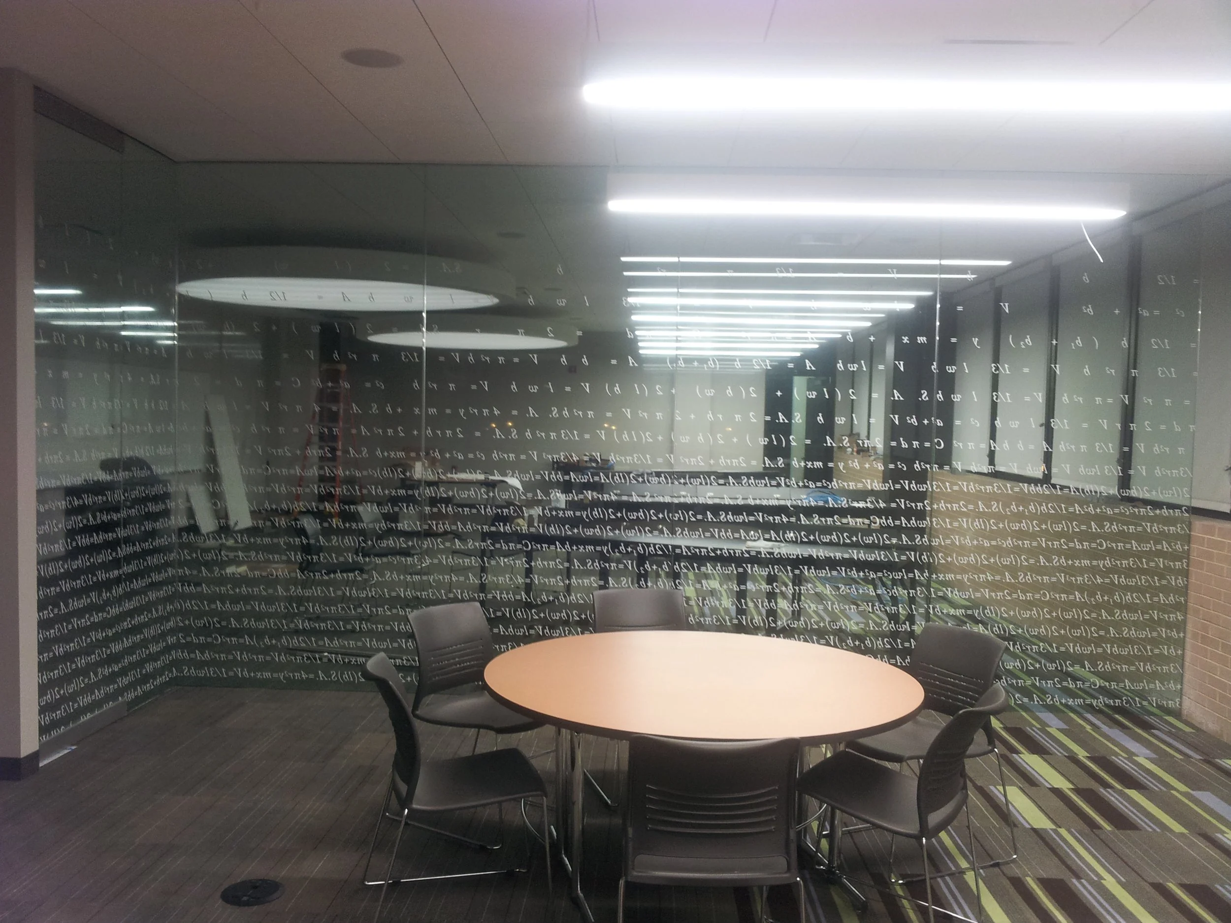 The gradient math problems on Lumitone film incorporate educational designs with fading opacity, creating an interactive and thematic visual treatment for the math lab's glass partitions.
Project: Math Lab, Harold Washington Univ | Design credit: Koo
