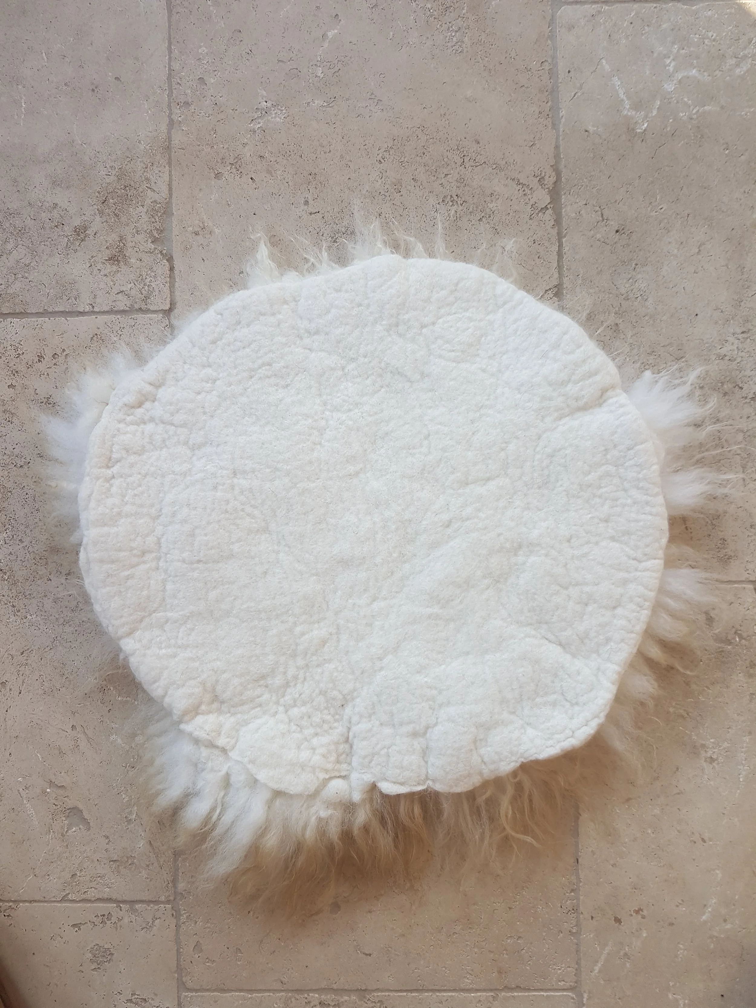 Back of felted seat pad on floor