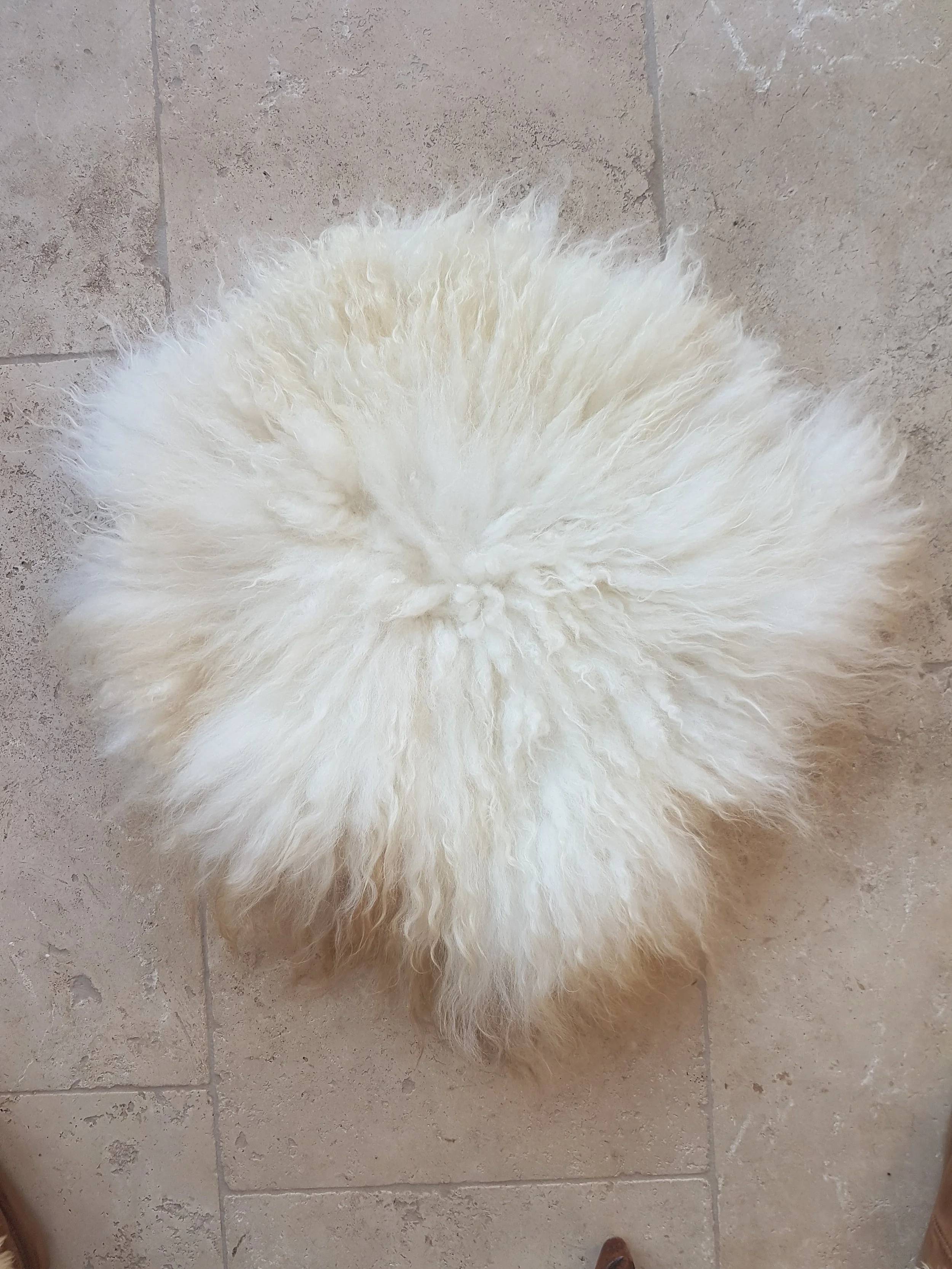 Felted seat pad on floor