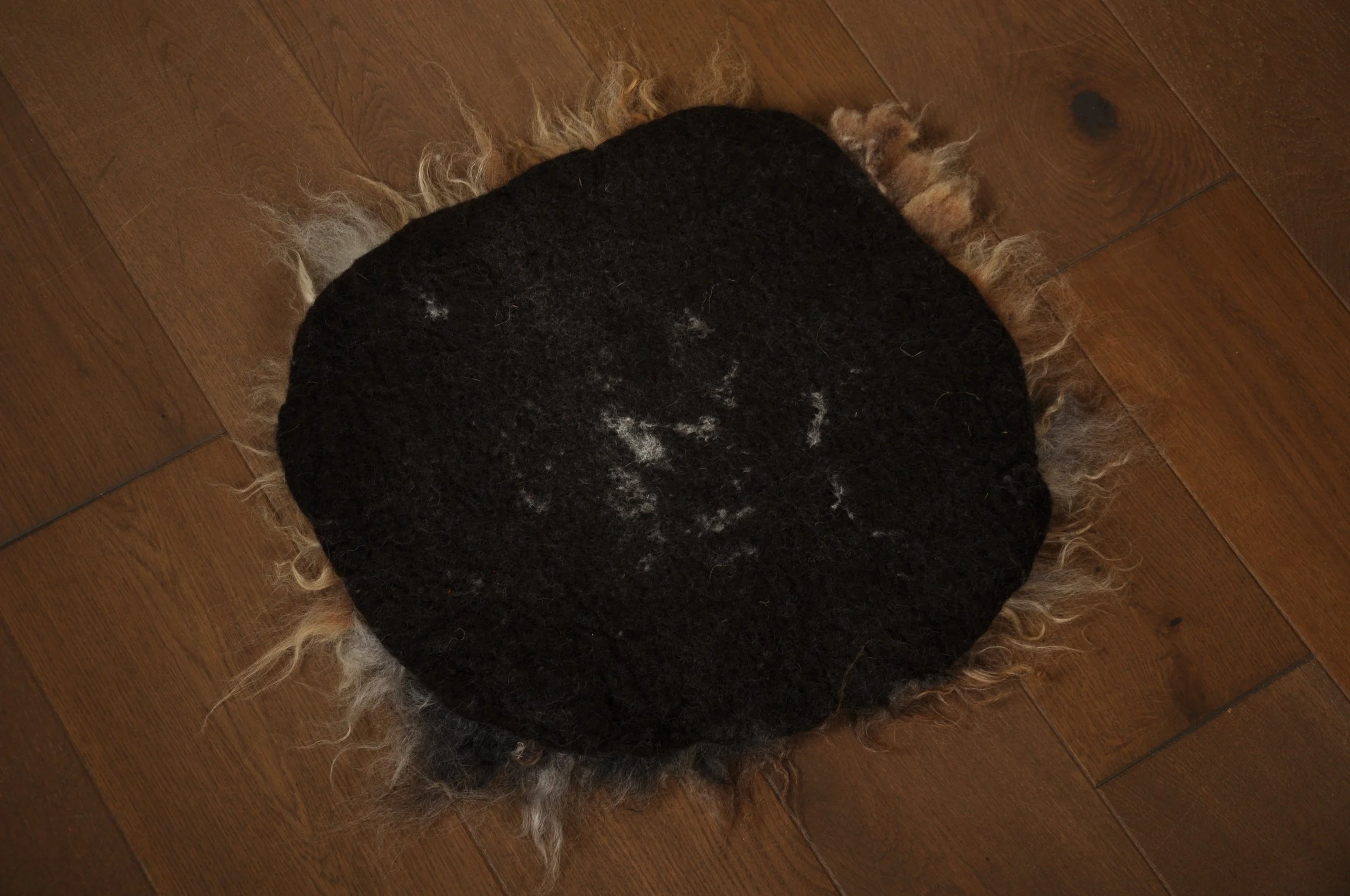 Back of felted seat pad on floor