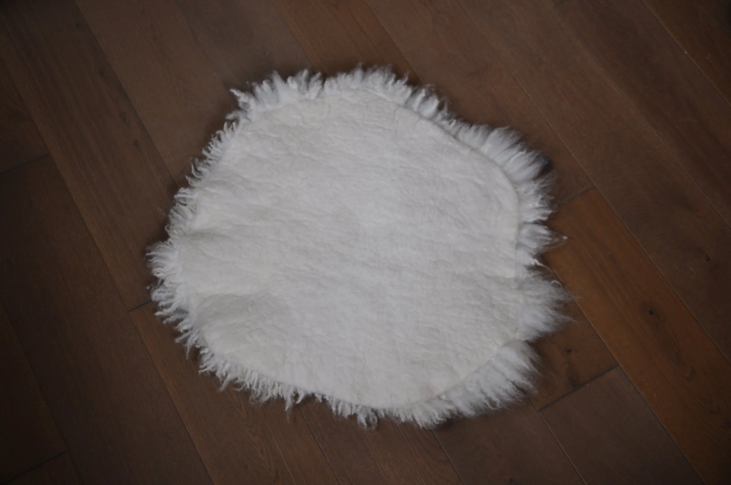 Back of felted seat pad on floor