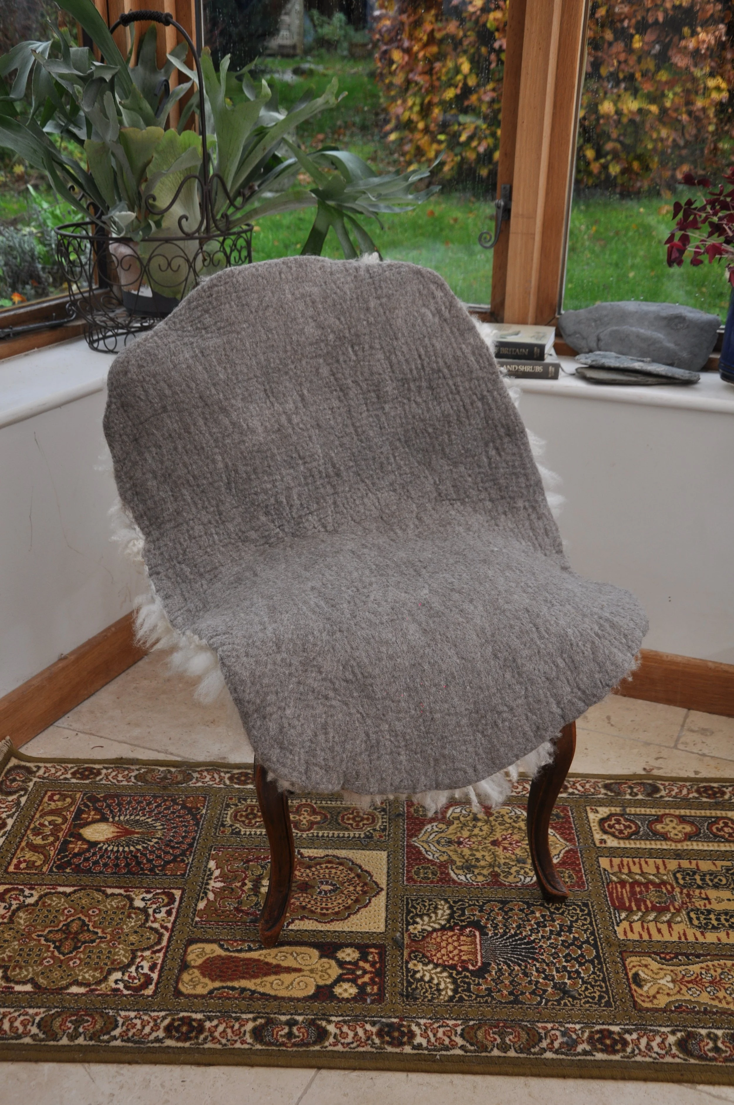 Back of felted rug on chair