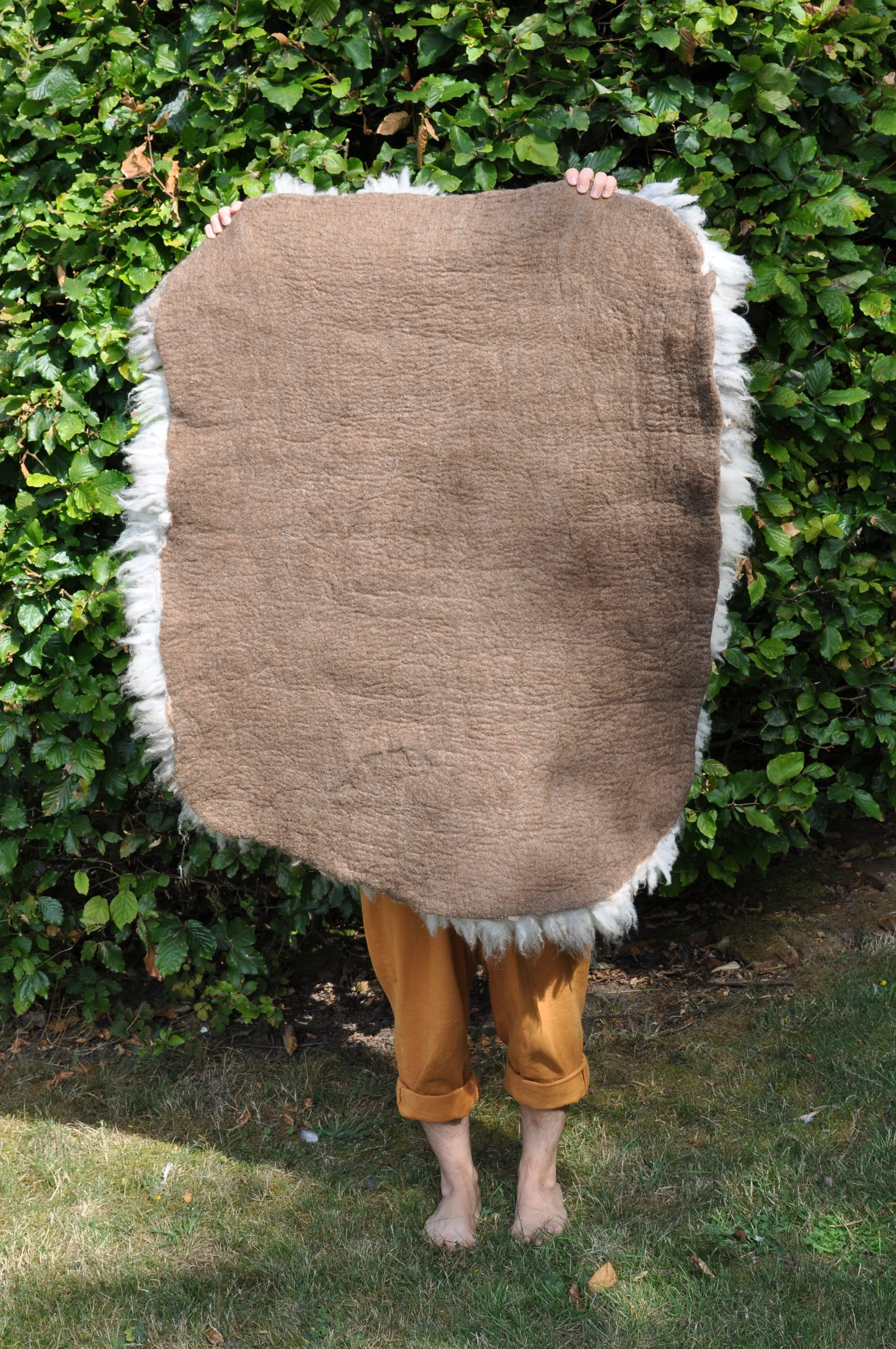 Back of felted rug outside