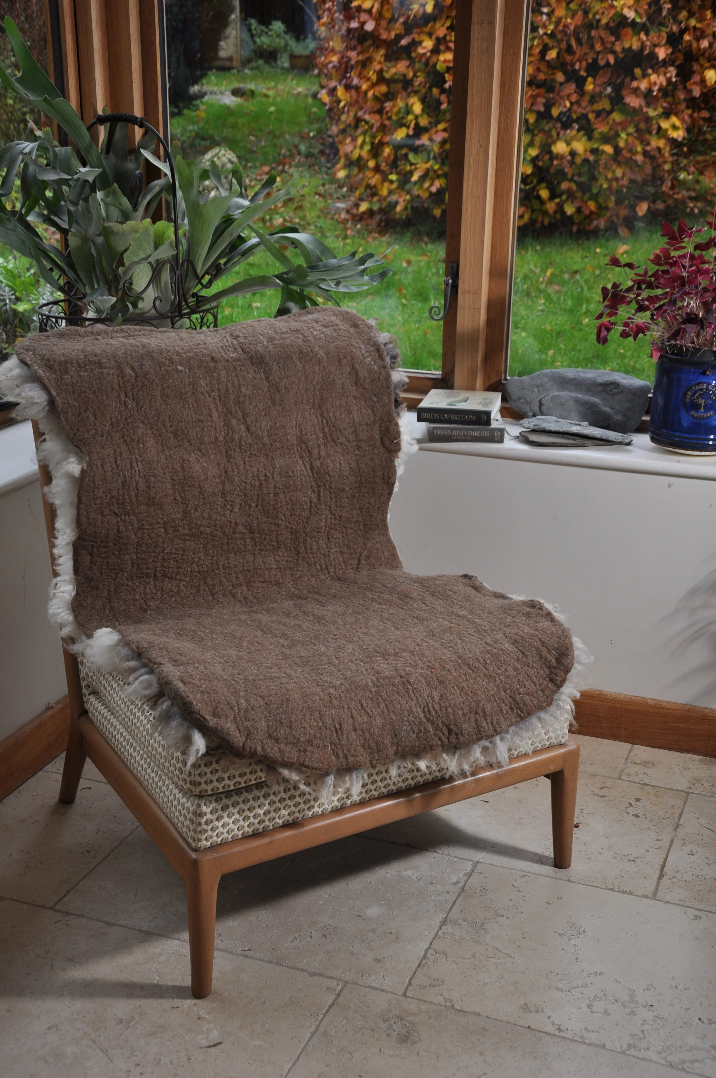 Back of felted rug on chair