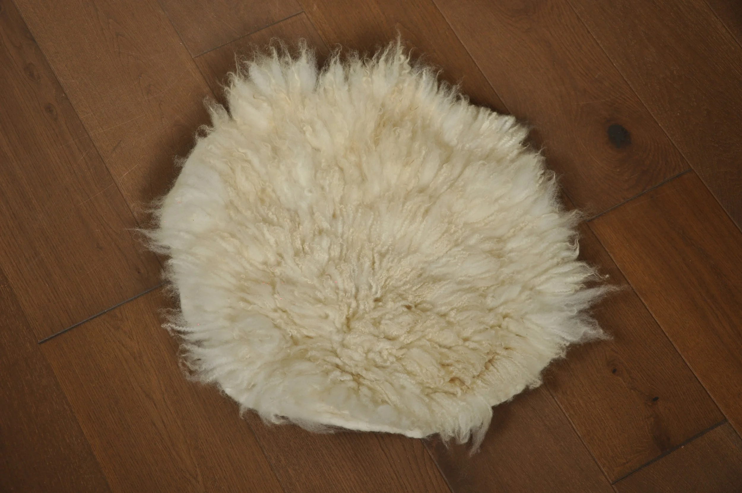 Front of felted seat pad on floor